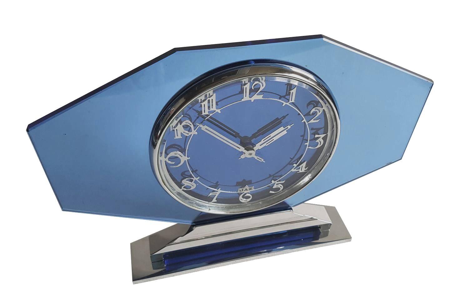 Very impressive and rare 1930s Art Deco blue glass and chrome clock by the French makers Jaz. Superb condition, both the glass and chrome are perfect as you could expect from a period piece of 90 odd years. We've had the clock mechanism fully