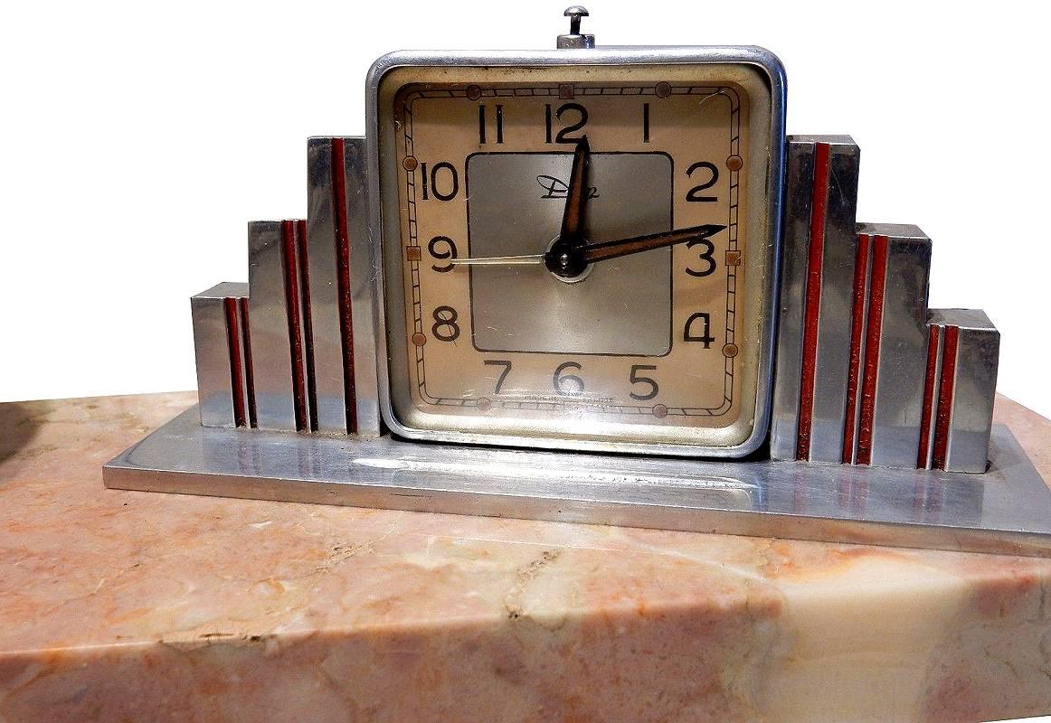 Well if we must be rudely awakened by an alarm at least make it something that's pleasant to look at. To that end for your consideration is this very stylish Art Deco table lamp with integral clock all of which originates from France. Resting on a