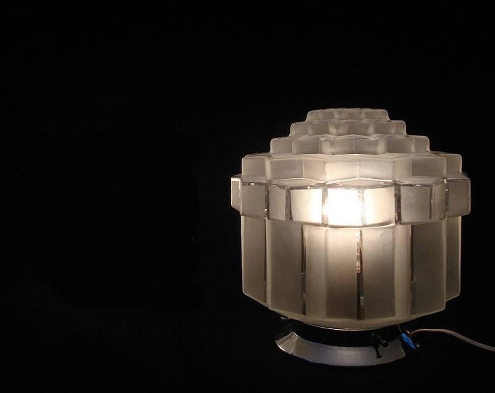 This ceiling light is an absolute gem and a must have if you love Art Deco, it can't be mistaken for any other era can it? Totally authentic and oozing style is very beautiful and rare. Frosted glass makes up the wonderful skyscraper design, these