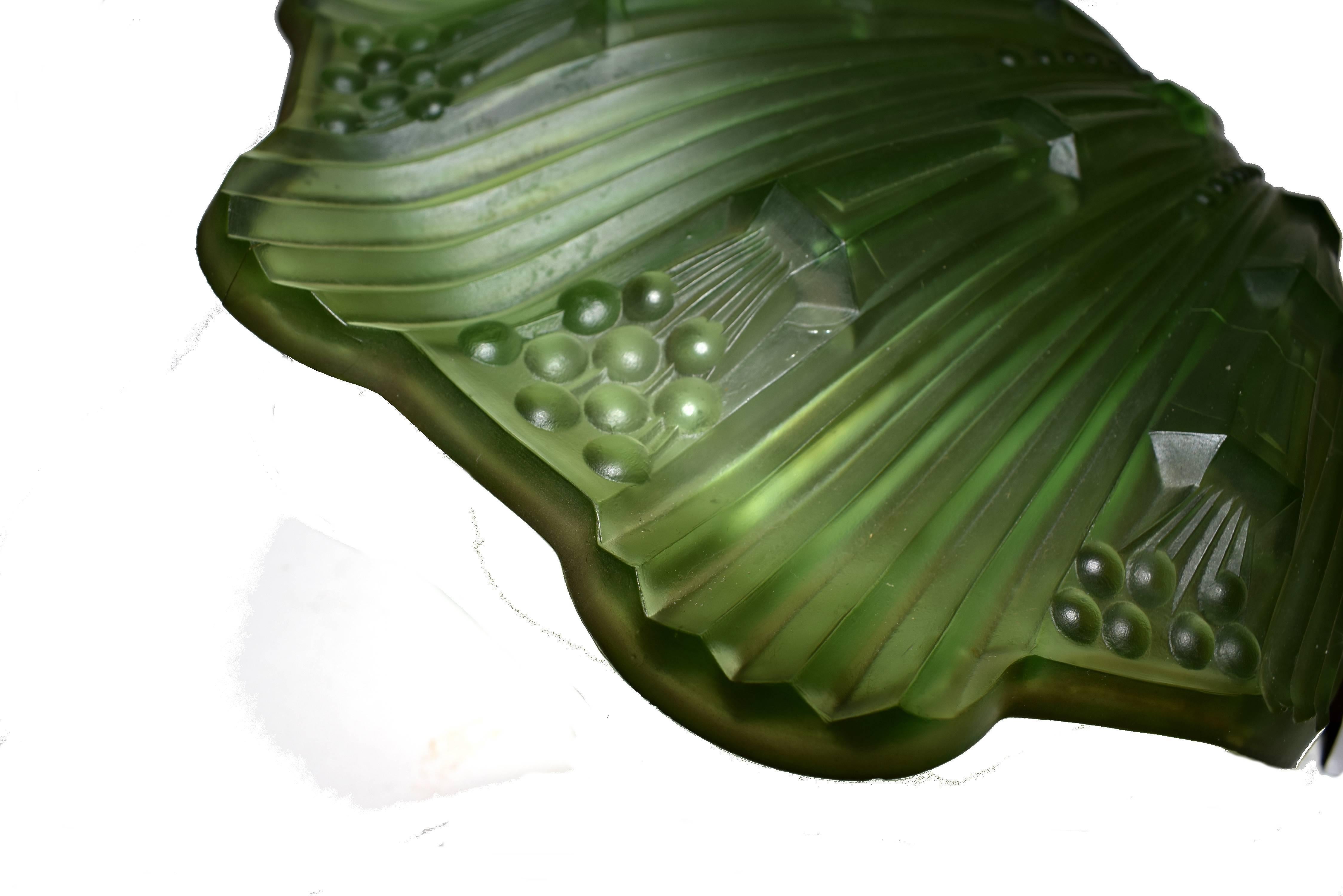 Superbly stylish matching pair of 1930s Art Deco green petal wall lights, in excellent condition with minimal signs of age. The back plates are highly polished chrome which contrasts beautifully with the glass shades. This particular style of Art