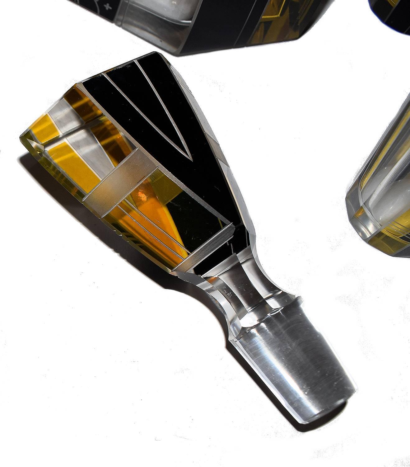 Fabulous Art Deco glass decanter set by Karl Palda. One of the more rarer designs with Fine enamel geometric decoration in yellow and black with etched detailing. Comprises a decanter, it's stopper and six glasses all in perfect condition, can't