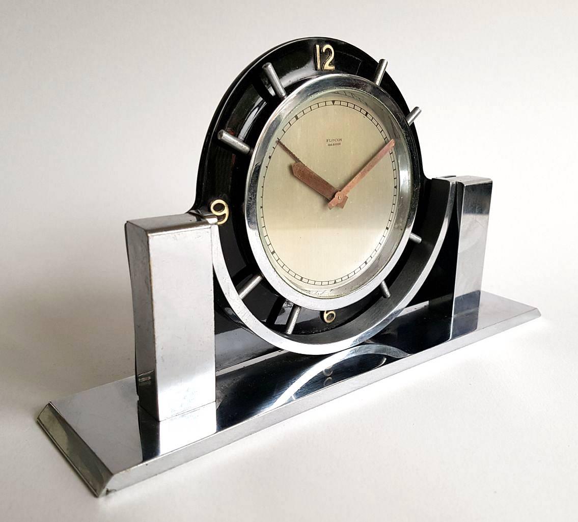 A lovely Modernist ImHof eight day alarm clock in Black Celluloid and chrome.
Imhof clocks were of finest Swiss production and the Swiss clock. Arthur Imhof S.A. of La Chaux de Fonds, Switzerland, was founded, circa 1924 and was in business until
