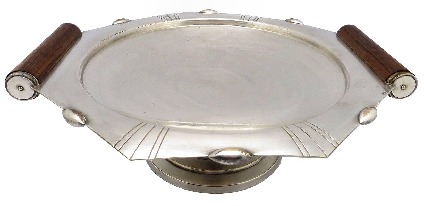 High styled, 1930s Modernist coupe or fruit bowl originating from France and stamped RM for Roux - Marquiand. The metal is silver plated and the handles with stylized column are Rosewood. A stylish statement to center piece any room or