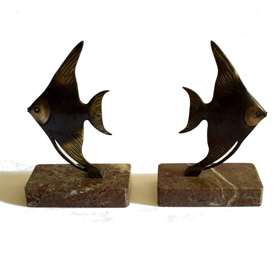 Wonderfully stylish 1930s Art Deco bookends. Originating from France they depict stylised fish in spelter both of which sit on solid marble bases. Condition is excellent, no damage, only patina to the fish.