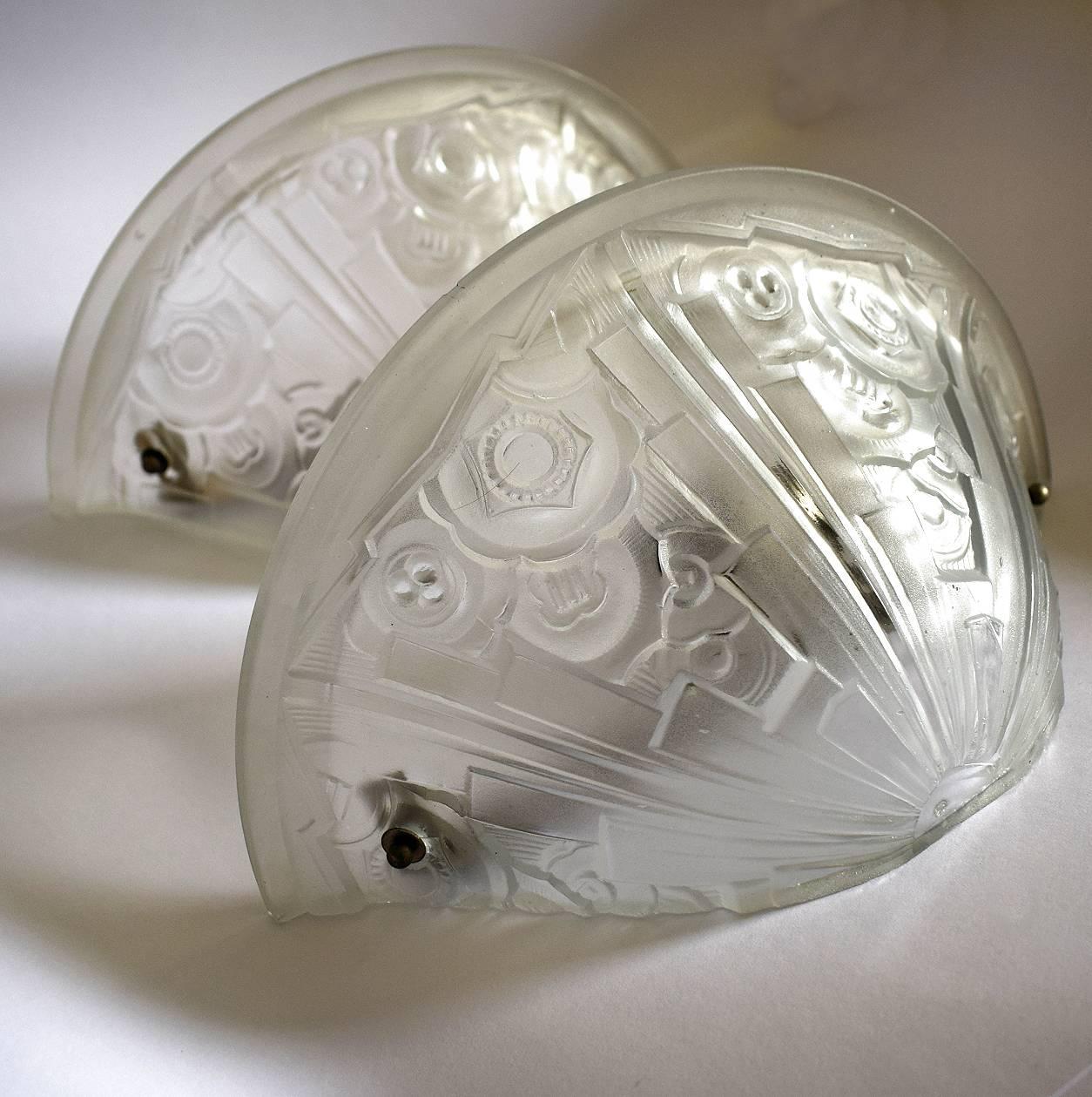 Beautiful 1930s Art Deco frosted glass wall lights with the most fabulous geometric engraved patterning, please see all pictures. Unsigned but very much in the style of Muller, Degue, Schneider etc. Totally original and to the period dating to