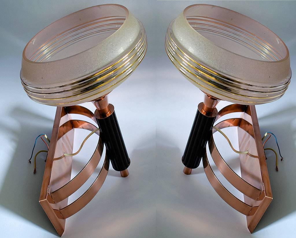 For your consideration are these 1930s Art Deco Machine Age wall light sconces in copper metal and bakelite with glass shades. Originating from England and rescued from a London Hotel these wonderful lights come to you in excellent condition. Both