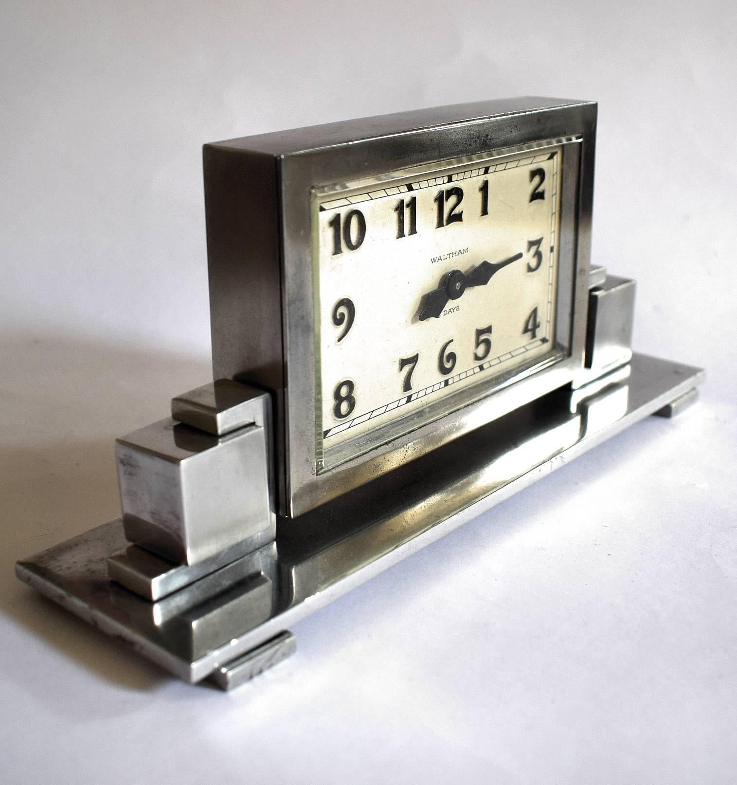 Art Deco skyscraper chrome 8-day mantel clock made by Waltham. Fabulous stepped design to the casing in above average condition. We've had this clock fully and professionally serviced by our horologist and so comes to you in very good working order.