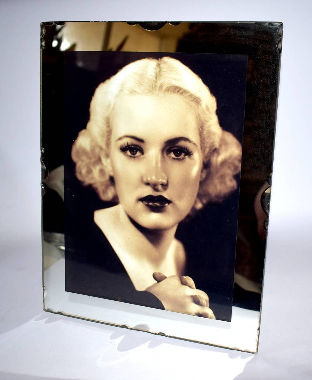 Very glamorous 1930s French Art Deco picture frame. This really is a beautiful frame, with mirror glass, bevelled edging and pie crust decoration to the edges, makes this a nice quality piece. Great in size too, ideal as a focal point to any room.