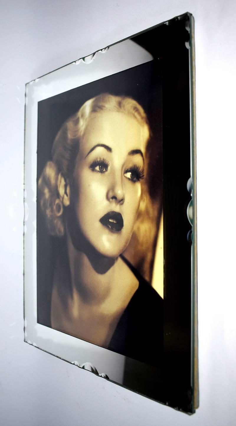 Stylish and glamorous 1930s French Art Deco picture frame. This really is a beautiful frame, with mirror glass, bevelled edging and pie crust decoration to the edges, makes this a nice quality piece. Great in size too, ideal as a focal point to any