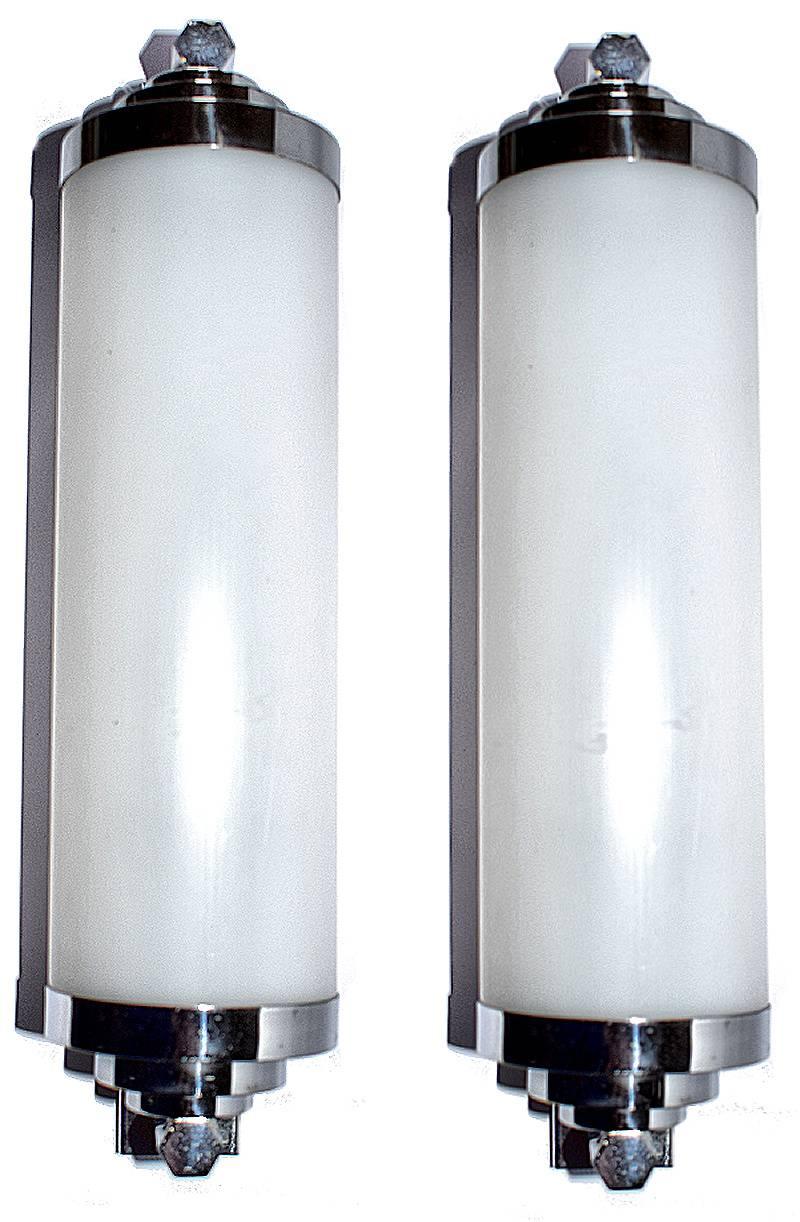 Superb matching pair of French opaque tubular wall lights. These lights are a great size for modern use and have many applications and possibilities either for home or commercially. They would suit well anything from a bathroom to dressing table