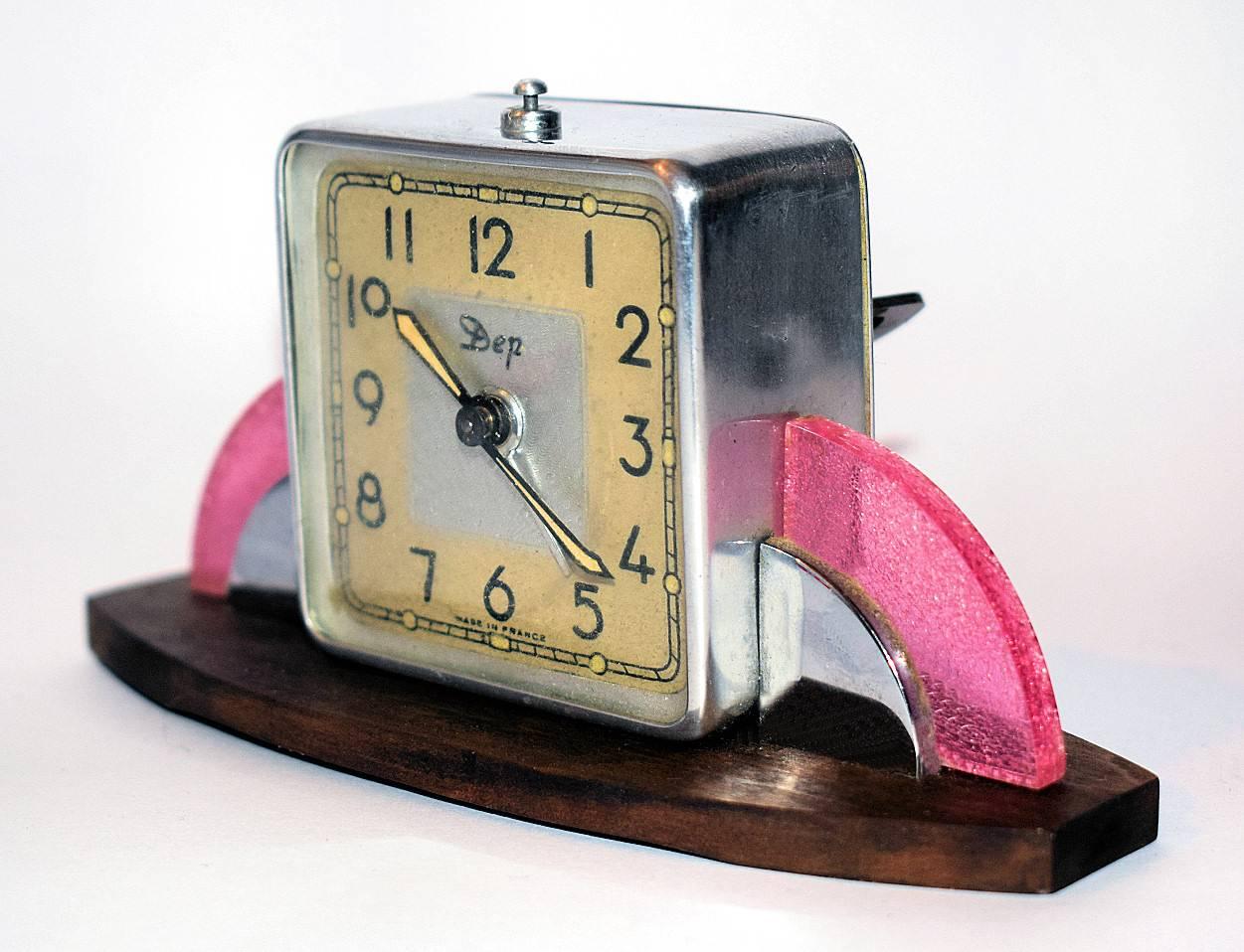 Attractive 1930s Art Deco Modernist clock by the French makers Dep. Features a wooden base with a rainbow of pink celluloid and chrome either side the main dial. We've had this lovely clock fully serviced and so comes to you in full working order.