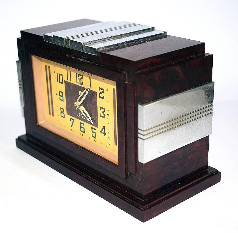 For your consideration is this 1930s Art Deco bakelite clock by Jaz a French clock company founded in 1919.
The case is of a wonderful mottled, chestnut brown Bakelite, styled in stepped form. The strong, bold lines set off the superb Bakelite