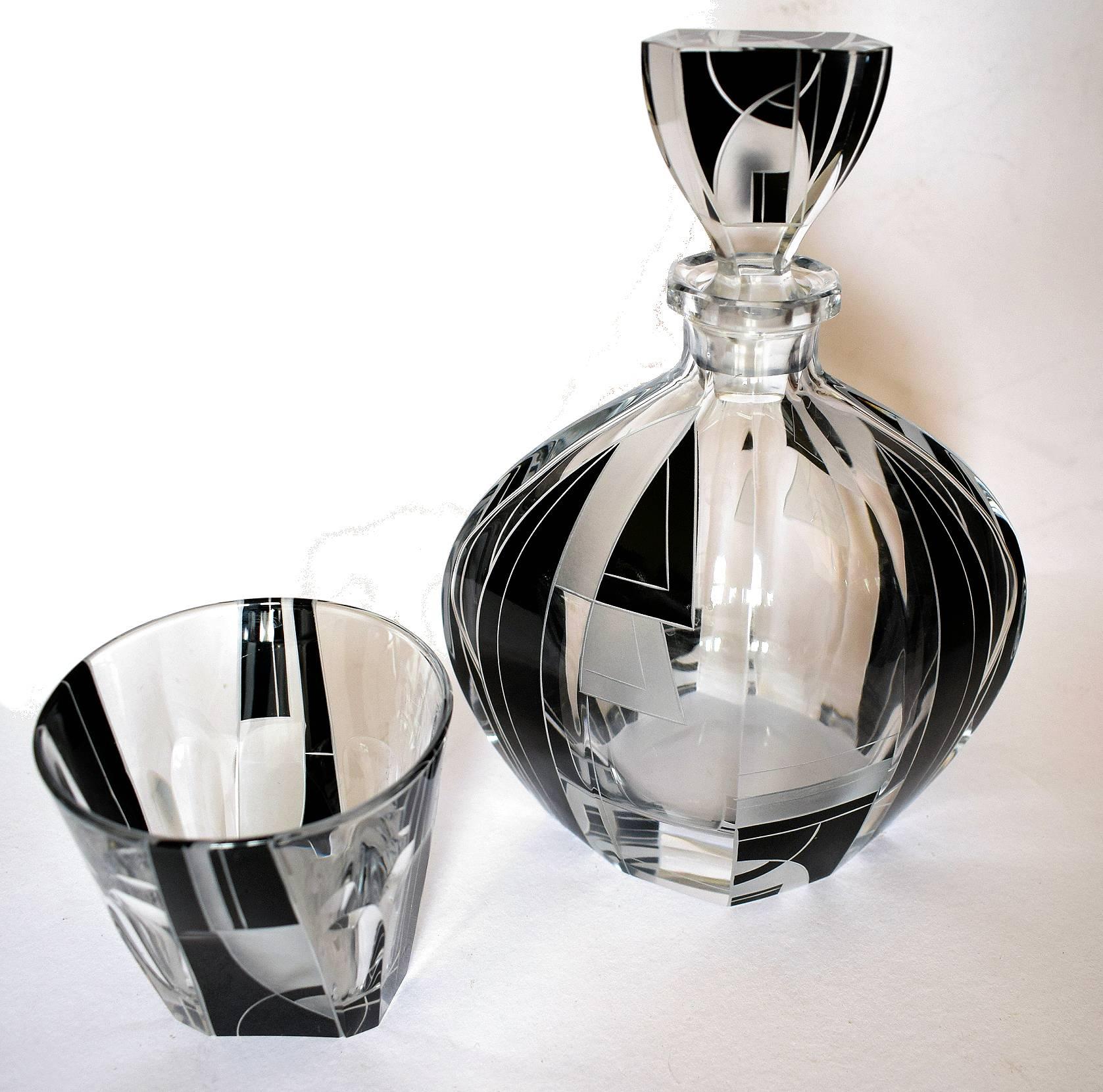 Fabulous 1930s Art Deco decanter set by Karl Palda. Comprises a heavy cut-glass decanter, stopper and four tumbler glasses, all with enamel geometric decoration. This wonderful set oozes quality. All in perfect condition. The drinking glasses are