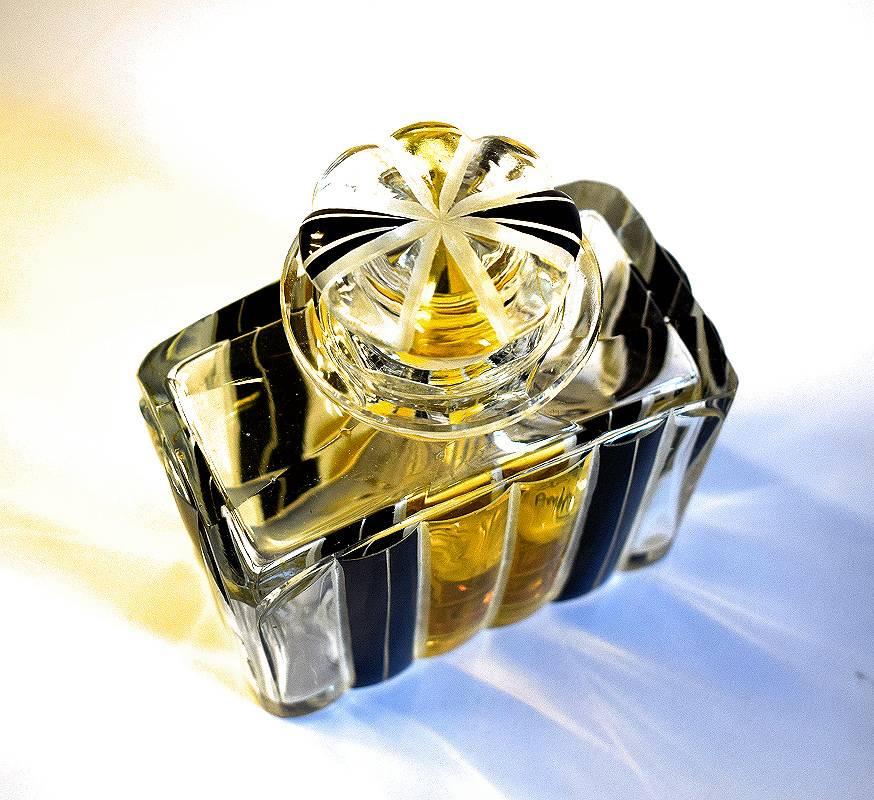 Beautiful Art Deco perfume bottle dating to the 1930s. Larger than normal these bottles look great either on a dresser in your bedroom or with colored water in your bathroom. Black and yellow enamel decoration in excellent condition.