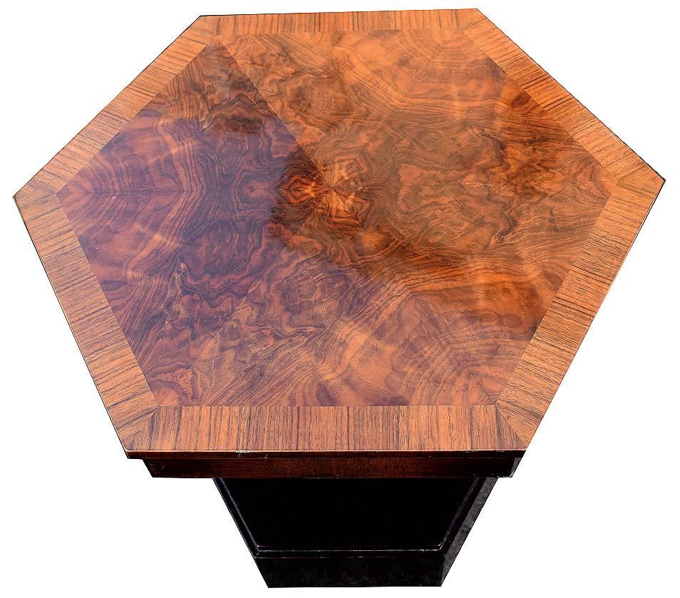 Very stylish and totally authentic, 1930s Art Deco English coffee table in hexagonal form. The veneers to the top and an absolute delight and a real sign of quality. We've had the whole piece fully restored so comes to you in excellent condition.