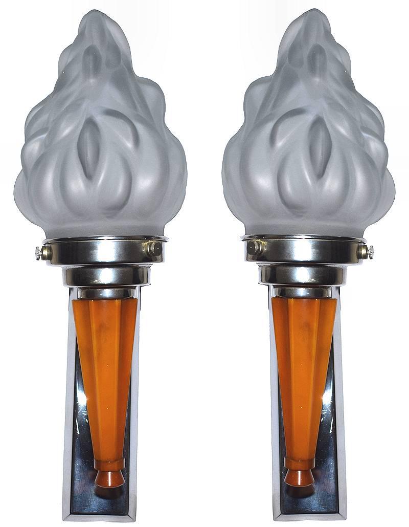 Very attractive 1930s Art Deco pair of English matching wall lights. These high style wall lights feature a single arm catalin bakelite stem, chrome back plates with frosted opaque glass flame shade. These lights look as impressive switched on or