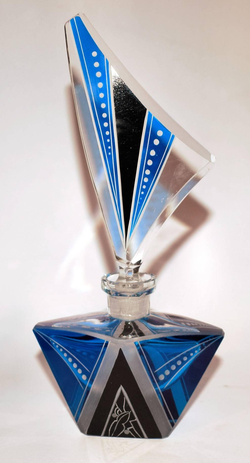 Art Deco blue glass perfume scent bottle. Beautiful and very collectible dating from the 1930s. French in origin. In vivid blue glass with black enameled geometric design.
It measures a whooping 30.5cm high. Condition is excellent with minimal