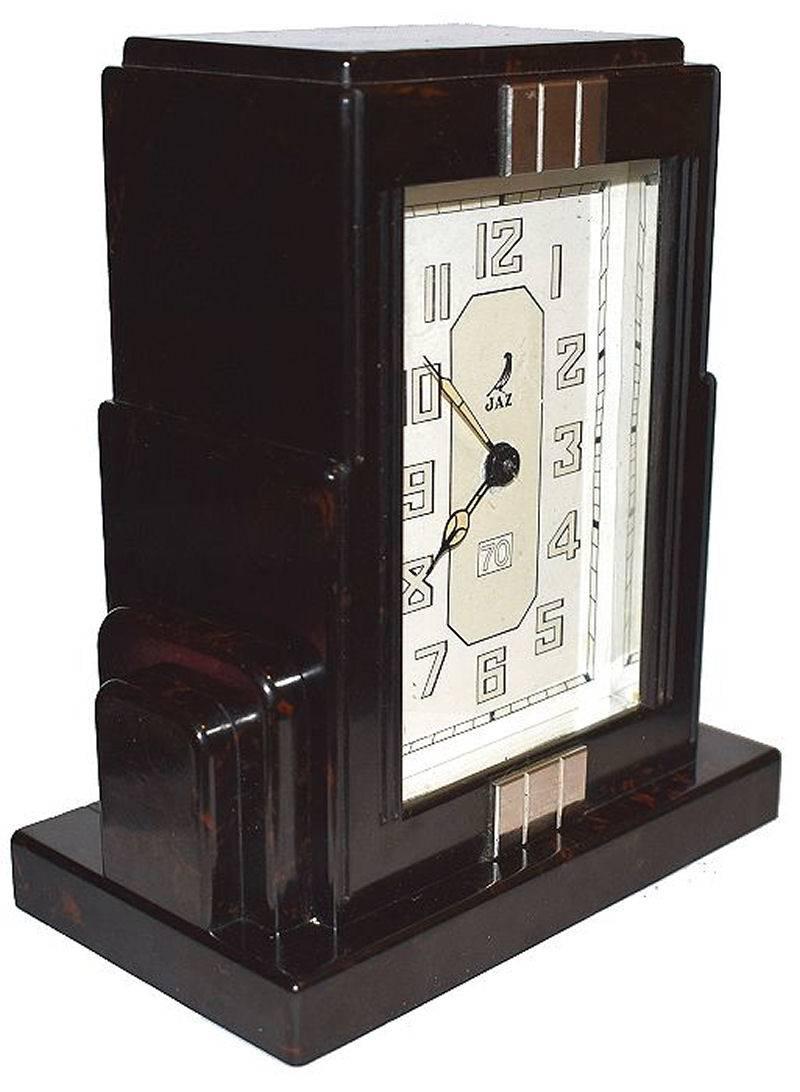 Fabulous Art Deco clock by Jaz a French clock maker. This clock is in a deep brown with black speckles and wonderful skyscraper shaped casing. The condition of the face is particularly good showing little to no signs of it's true age. The Bakelite