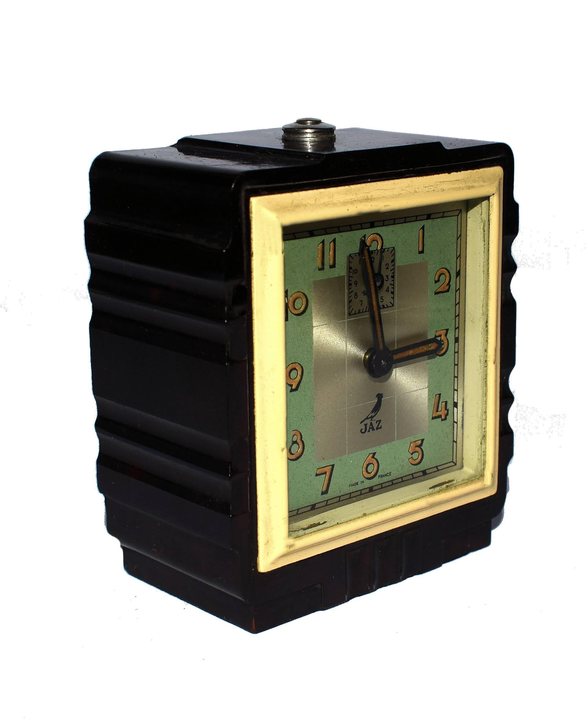 Very attractive 1930s Art Deco French alarm clock in miniature form. These clocks are without doubt very hard to come by in this size, we've only had 3 in the past year. Made by the French maker Jaz. In very good condition, the bakelite is as bright