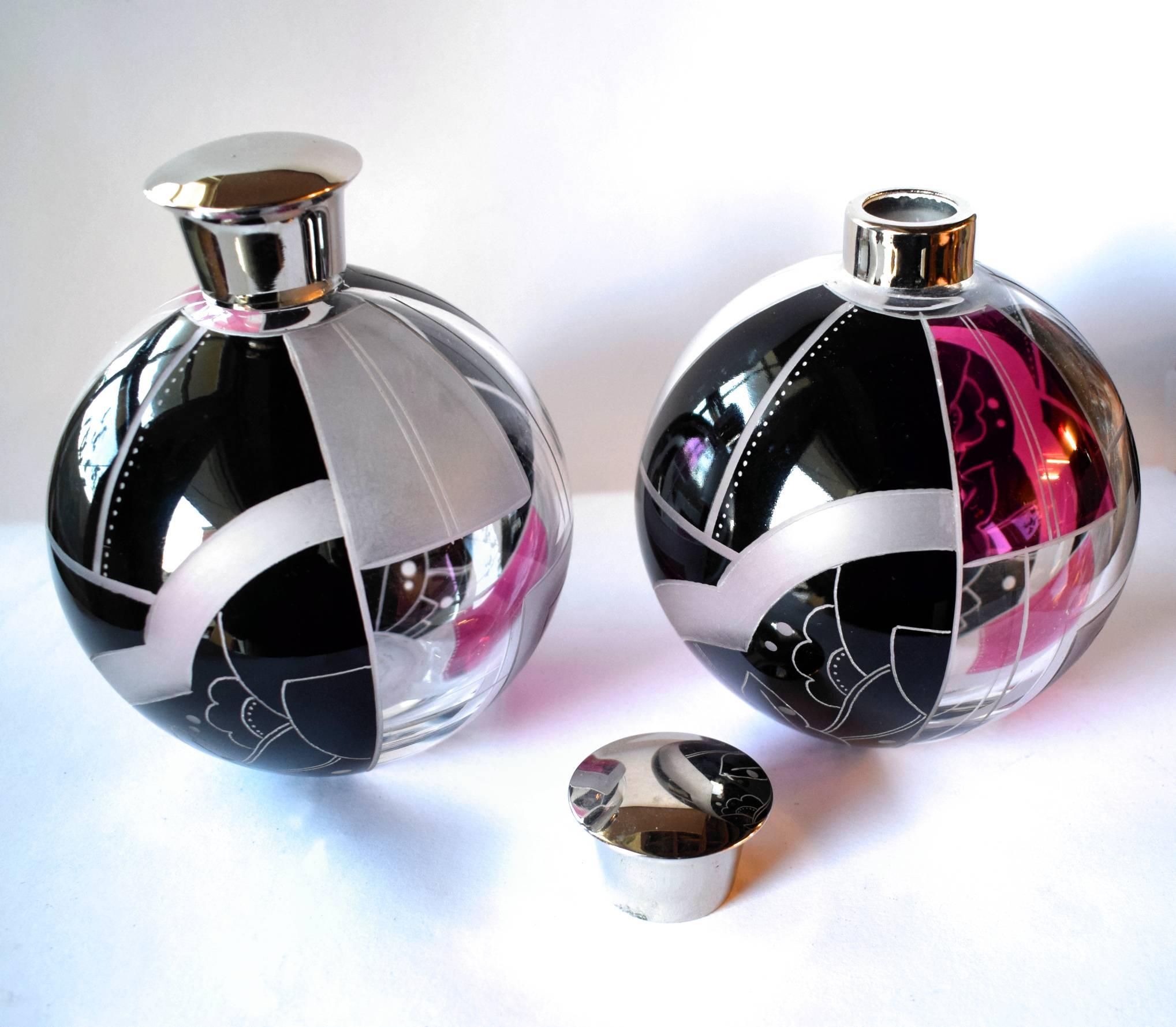 Such a rare find are these matching pair of large globe shaped Art Deco perfume bottles by Karl Palda. They are absolutely exquisite, every angle and side has a different design. I really can't sing the praises of these enough, if you want something