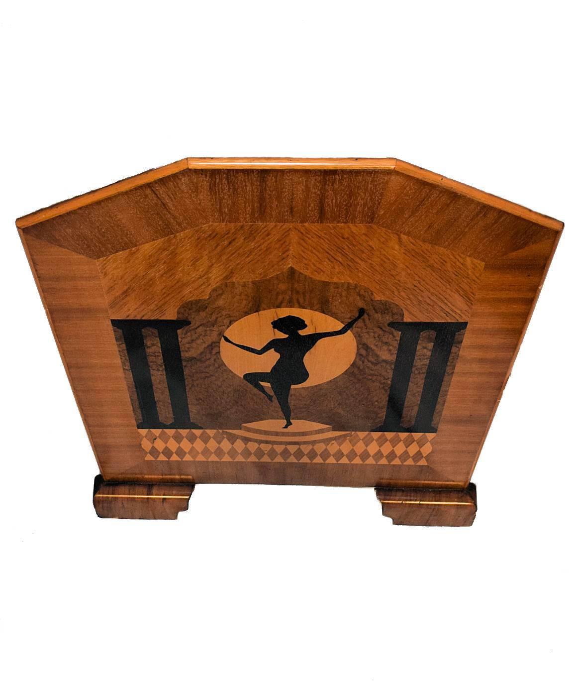 Delightful 1930s Art Deco English fire guard screen. Veneered in varying woods including walnut, maple veneer with applied decorative motif depicting a lady in a dance pose. This screen will make a wonderful featured piece any where in the home.