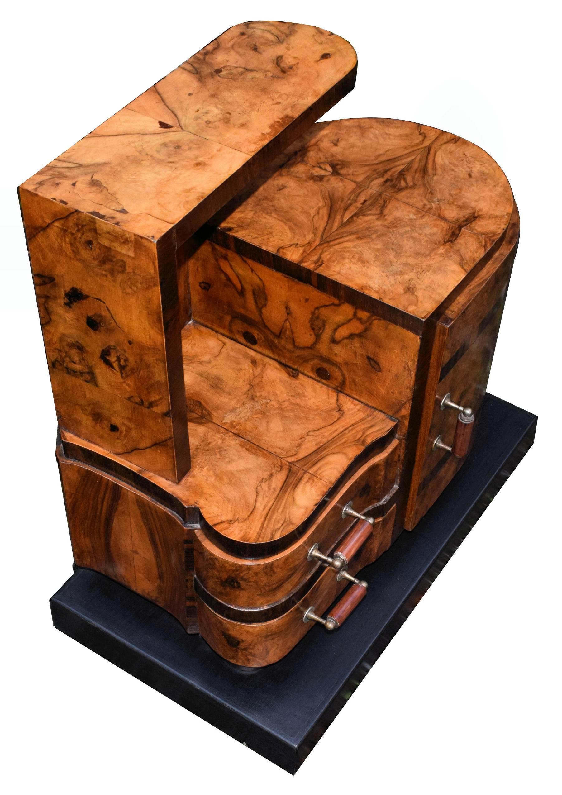 A rare opportunity to acquire such high styled and totally original Art Deco bedside tables. Originating from Italy and dating to the early 1930's they fill both the highly desired shape of Art Deco at its best and sort after the luscious veneers