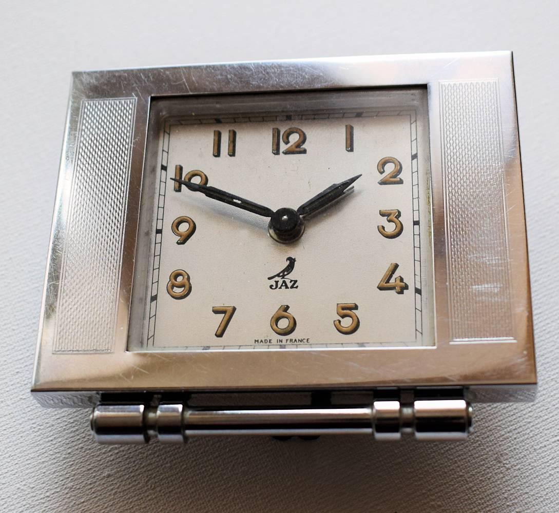 Very cute and quite rare little Art Deco chrome French alarm clock by the well-known makers 'JAZ'. This clock is a real delight and totally authentic. Quite a weighty little piece and in above average condition. 95% of the chrome is crisp and clean.