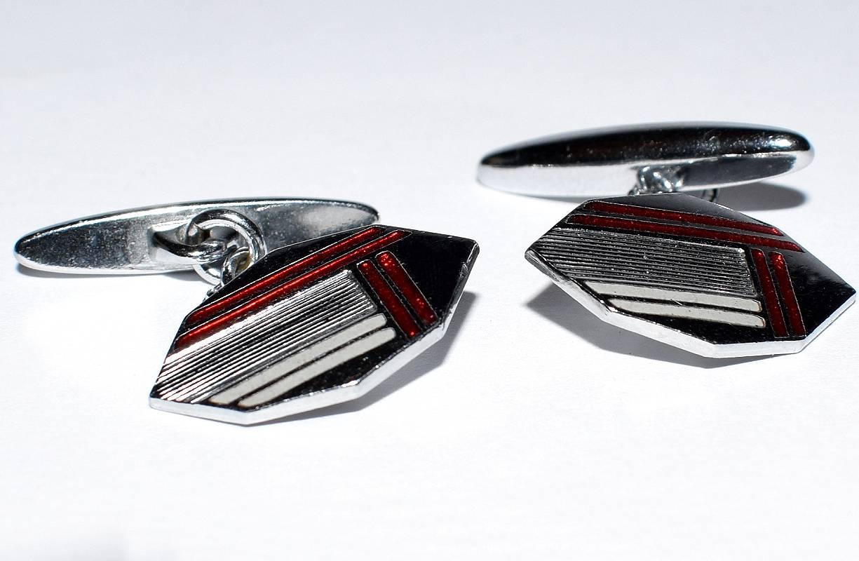 Fabulous pair of matching Art Deco men’s cufflinks with a great geometric pattern. Silver toned metal with red enamel decoration. Condition is very good.