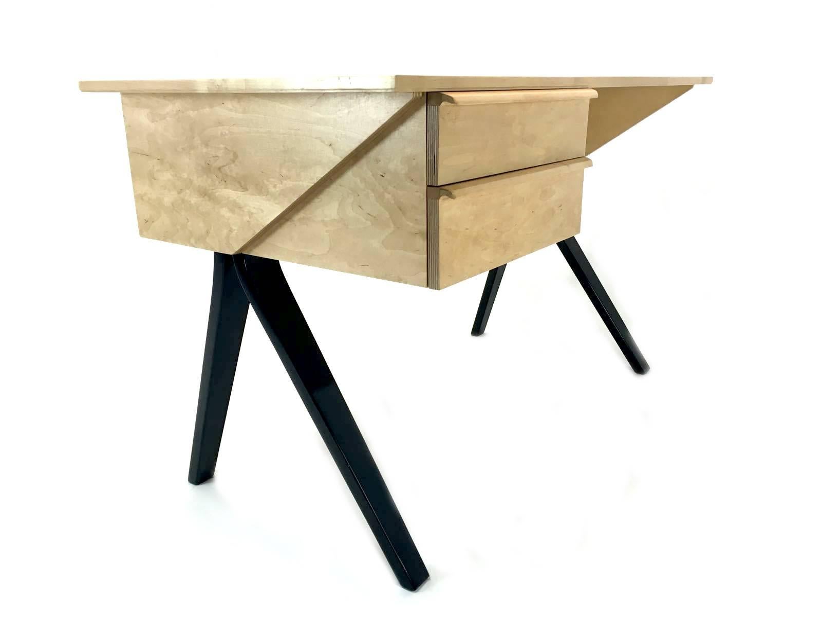 This model EB02 birchwood writing desk was designed by Cees Braakman and Adriaan Dekker. It was manufactured by UMS Pastoe in Holland between 1952 and 1954. This edition features black feet and is completely refurbished.

We ship worldwide, do not