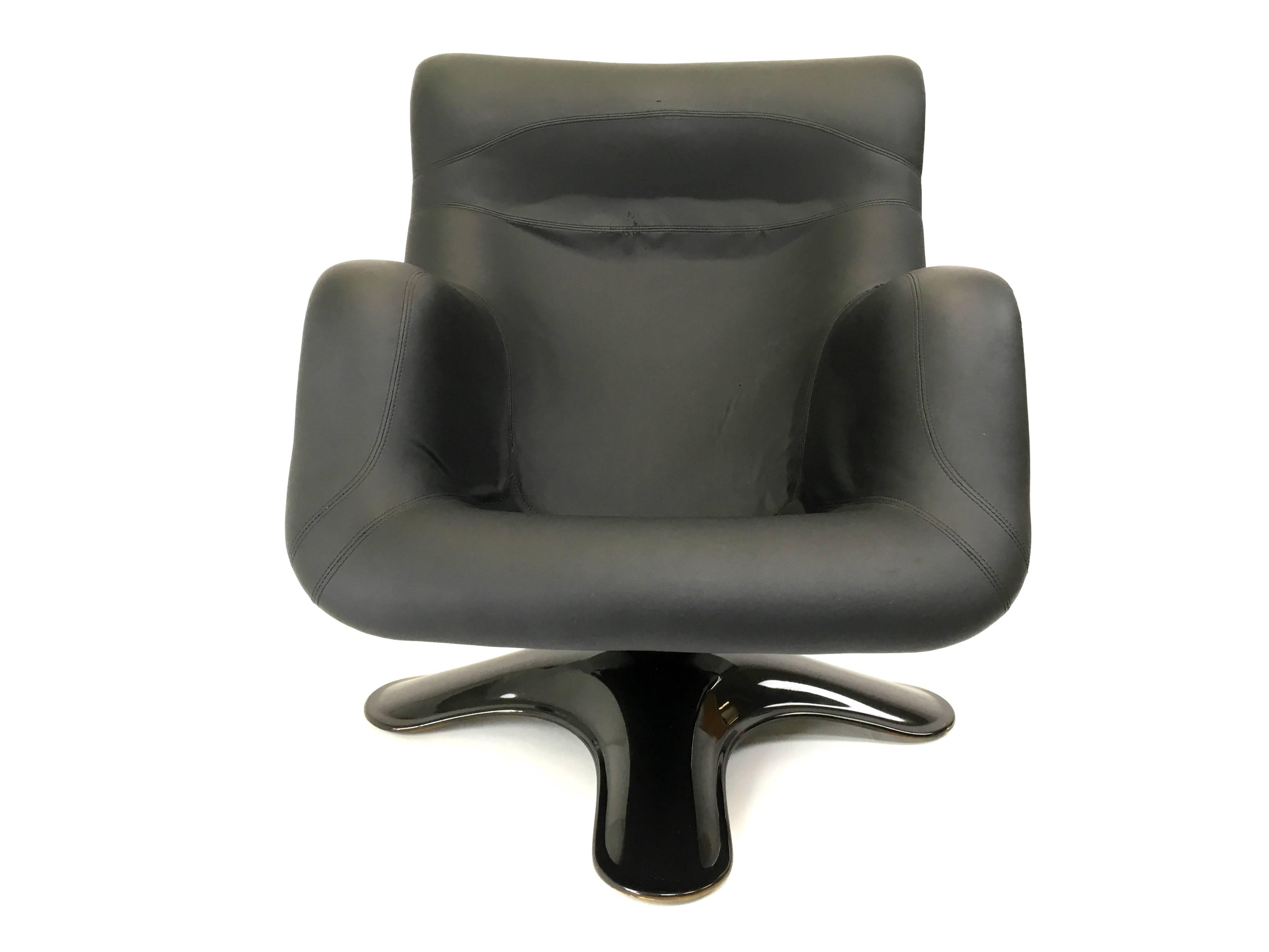 This futuristic swivel lounge chair was designed by Yrjö Kukkapuro for Haimi and was produced in Finland in 1964. The piece features a black fiberglass body and pedestal, and a seat upholstered in black skai.

We ship worldwide, do not hesitate to
