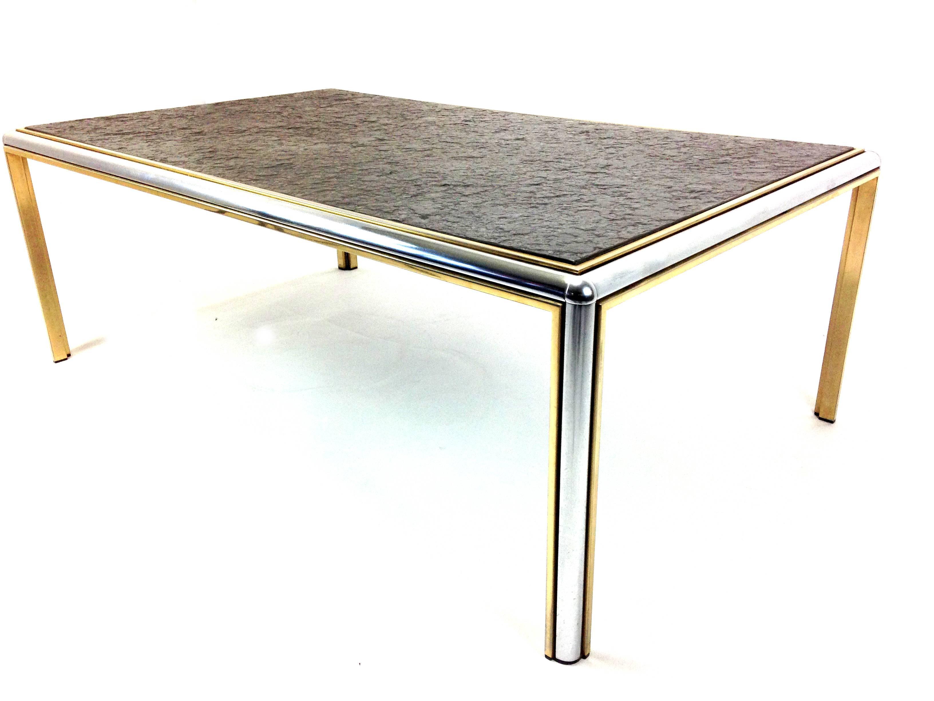 This slate top coffee table features a textured slate set upon a sturdy metal base. It is also made from brass and chrome.

We ship worldwide, do not hesitate to contact us. We inform you about the best price available, customized to your order.