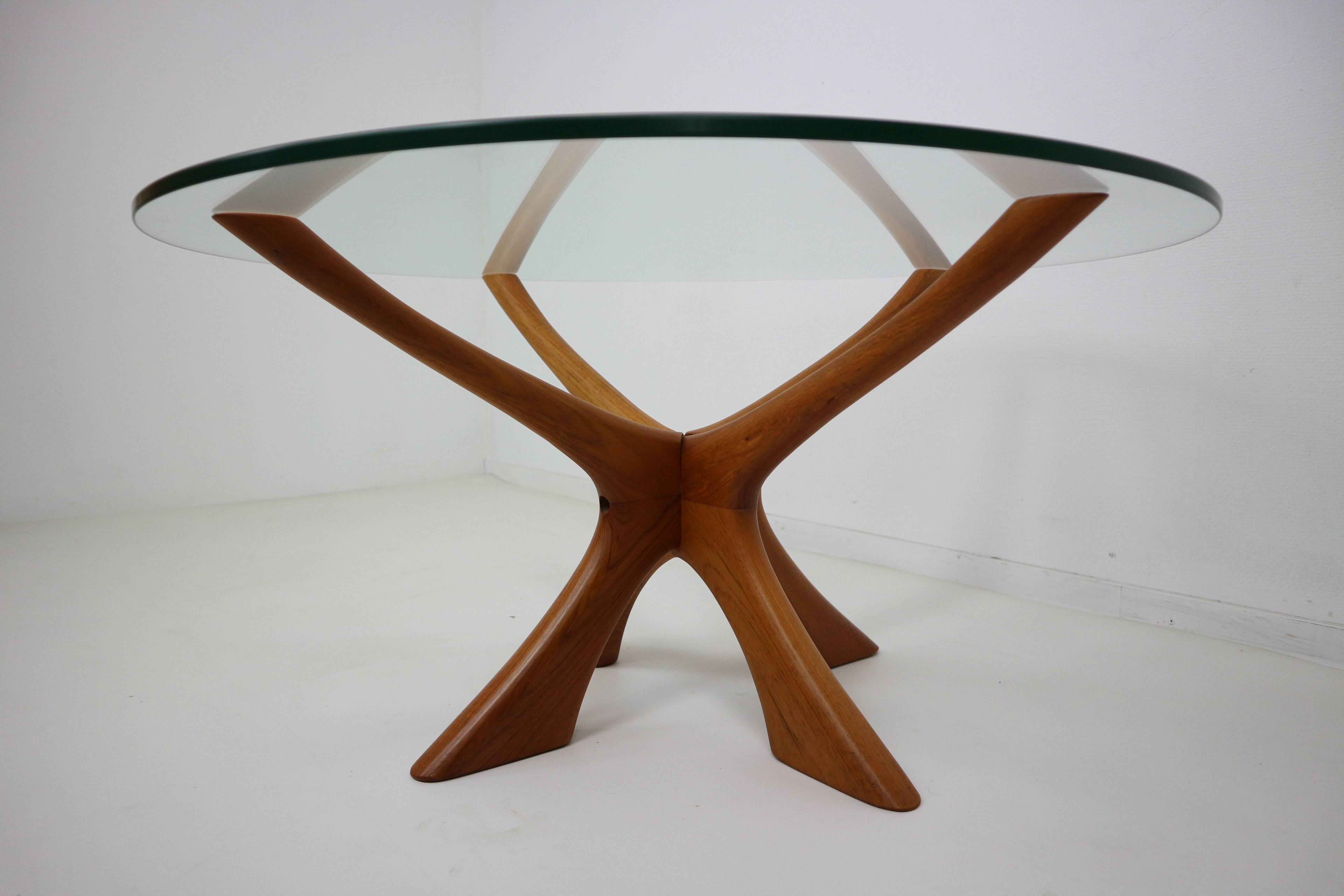 A Classic centerpiece for any room, the elegant antler-like base reaches up from the ground balancing a delicate glass top. The Wikkelso coffee table is unique in its organic form for a designer often known for his geometric shapes.
Teak frame and