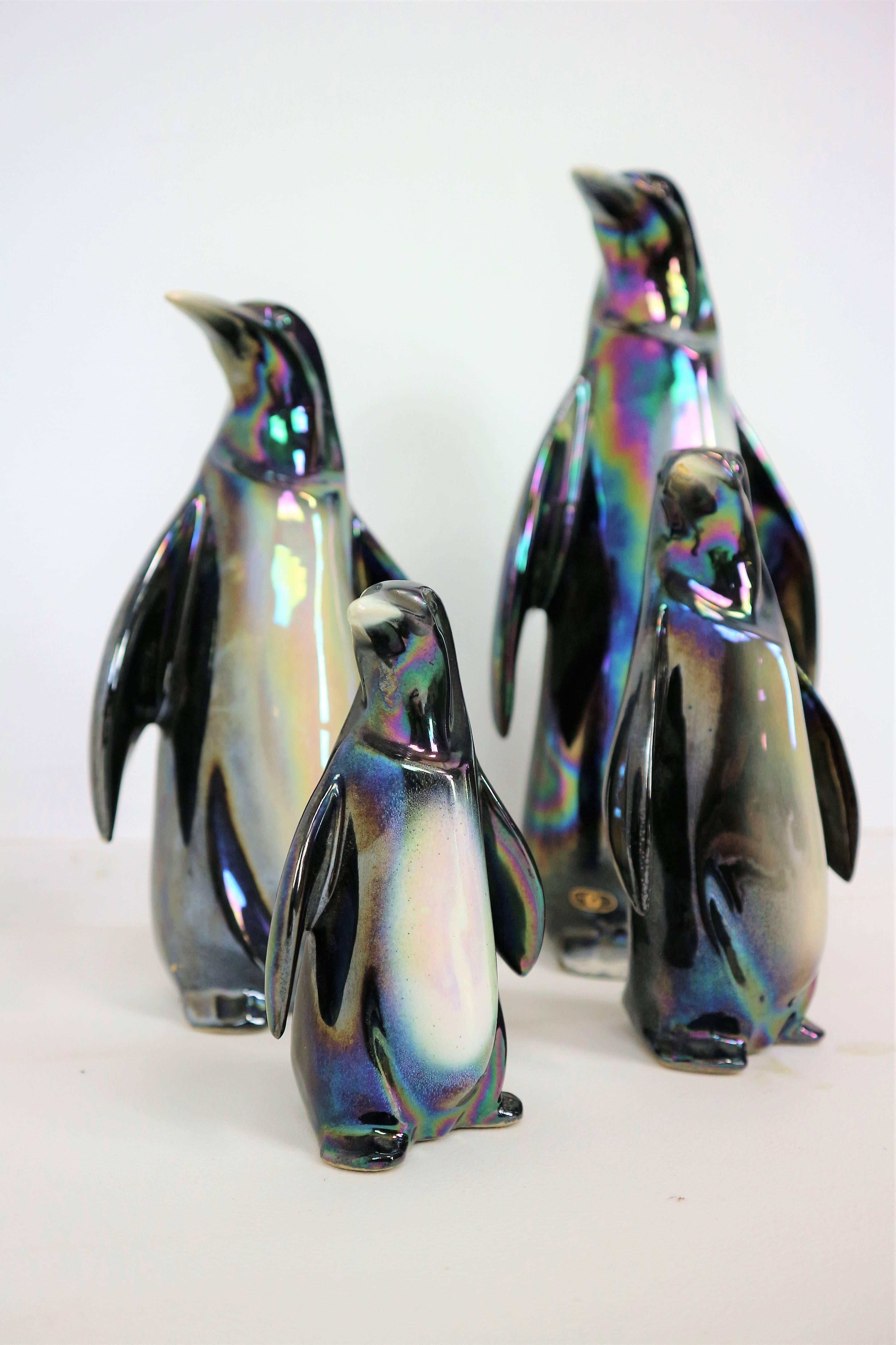 The set contains of four ceramic penguins, all in great condition.
The penguins are all market and numbered by the maker and make a beautiful and unique set together. Beautifully hand-painted and glazed with a pearl shine.
The heights are: