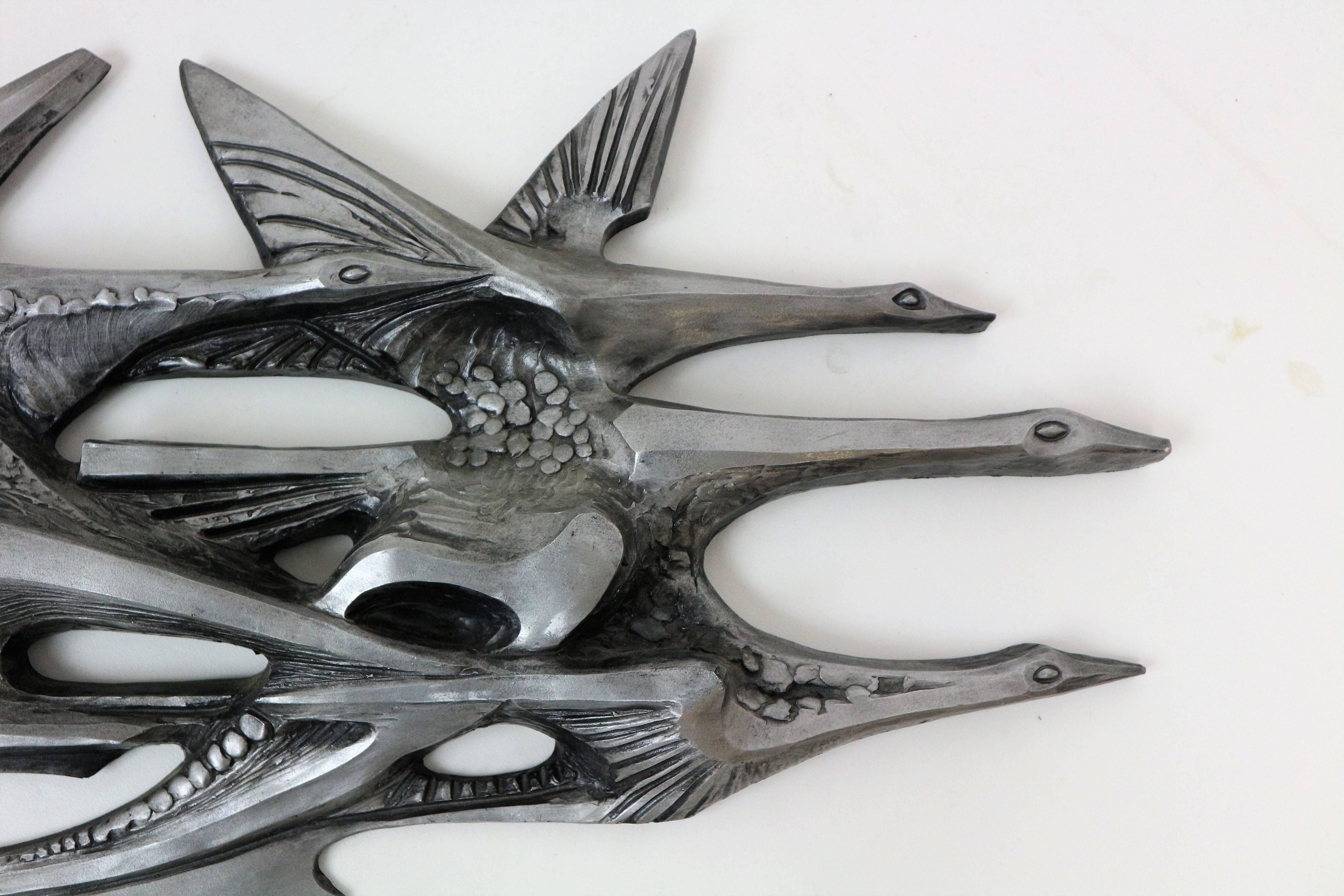 Beautiful shaped abstract wall art sculpture of flying birds by unknown designer.

 