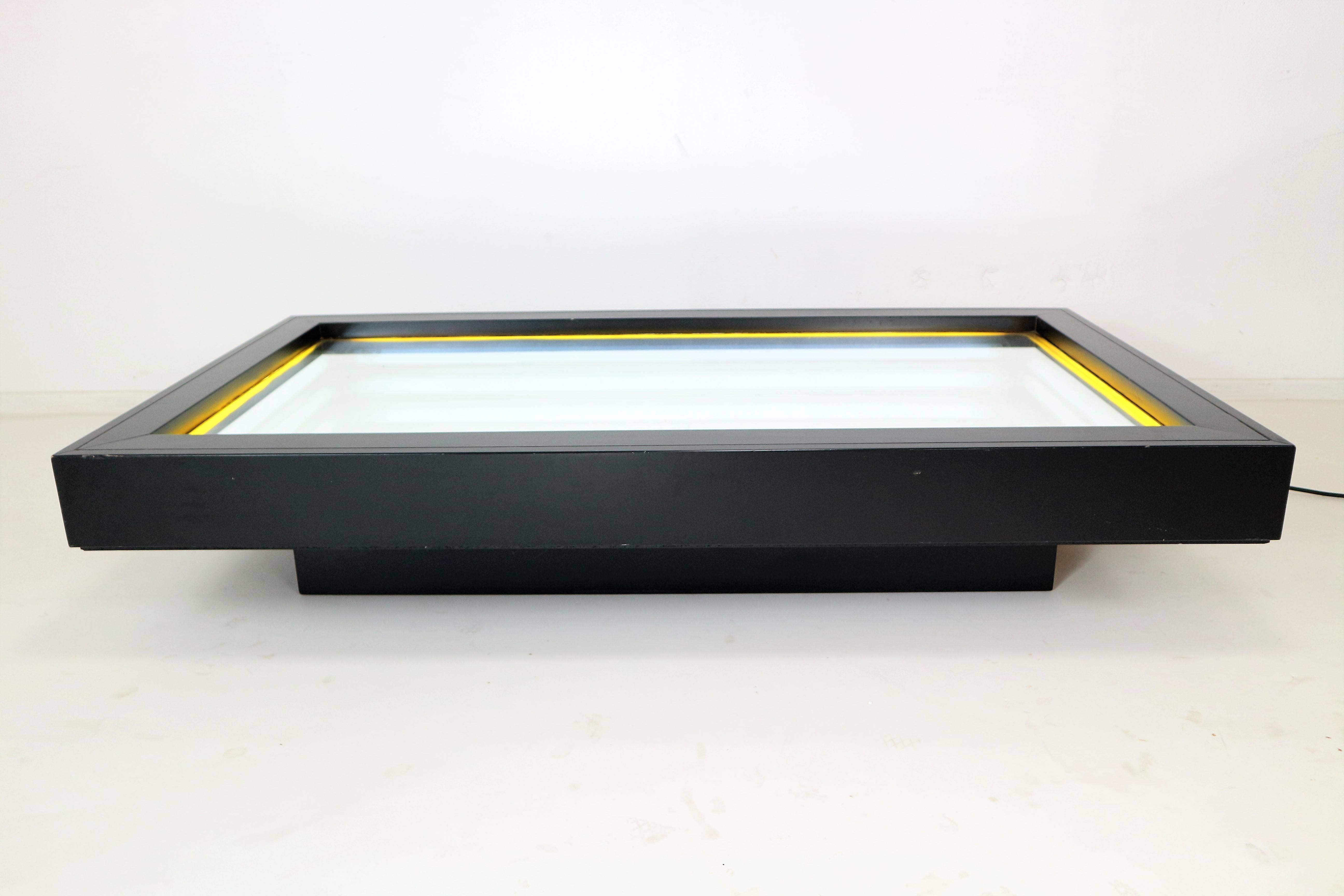 Rare Christian Megert 'lichtobject' limited Op Art coffee table/lighting object for Rosenthal Studiolinie. Designed 1978, just 100 were made! Beech frame, painted black, mirror glass, three-dimensional lighting via reflection, neon tubes. Slight