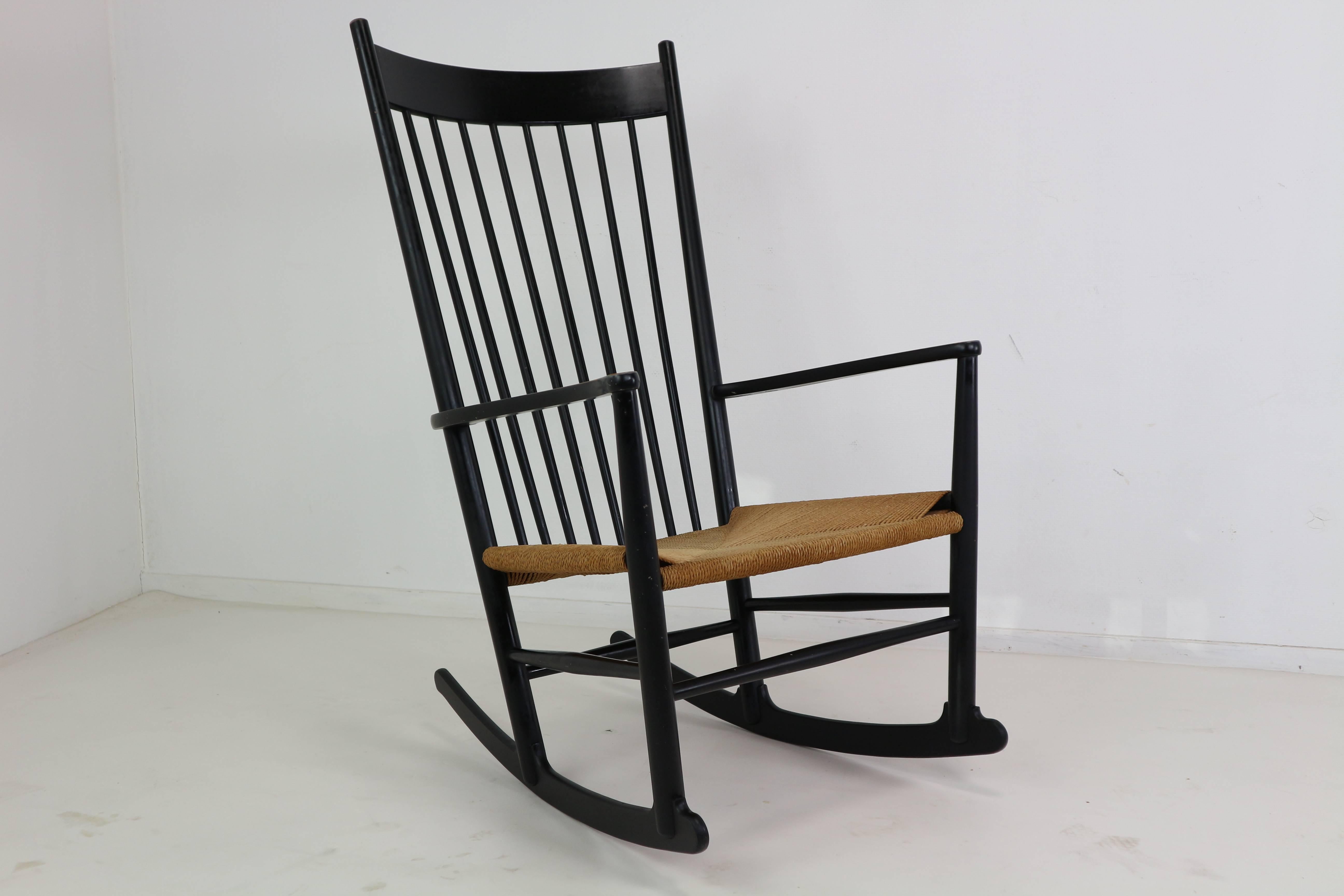 The rocking chair J16 was designed by Hans Wegner in 1944 and manufactured by Mobler F.D.B. Denmark. 
The chair is marked and produced in 1969.
The seat frame is made of black lacquered beechwood and the seat is made of papercord.


 