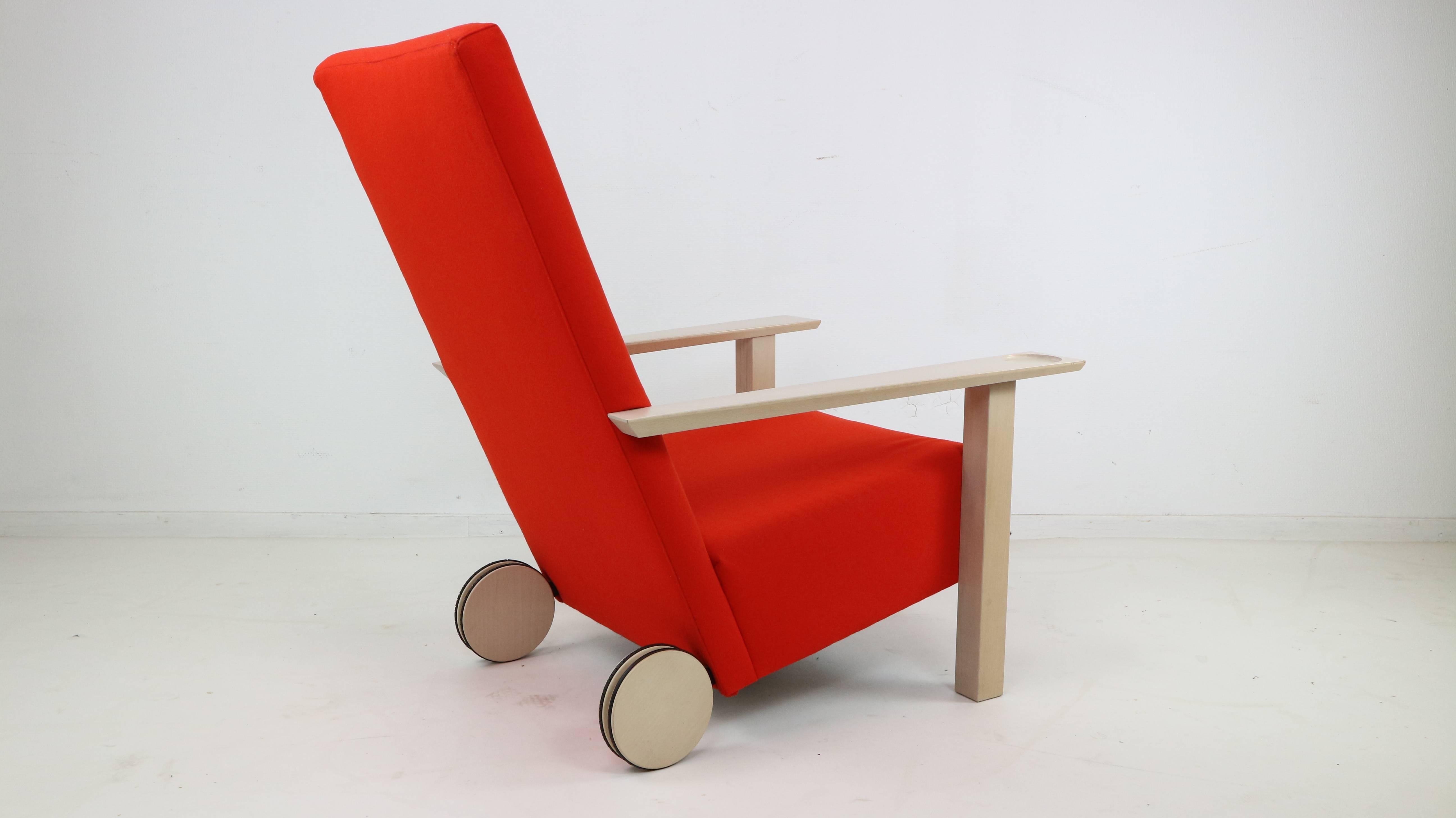 Burkhard Vogtherr, armchair model 'Small Room' for Cappellini. Designed 1995. Light wood construction, red wool fabric covers, equipped with two wheels. Slight traces of wear commensurate with age, the rubber coating of the wheels is partially