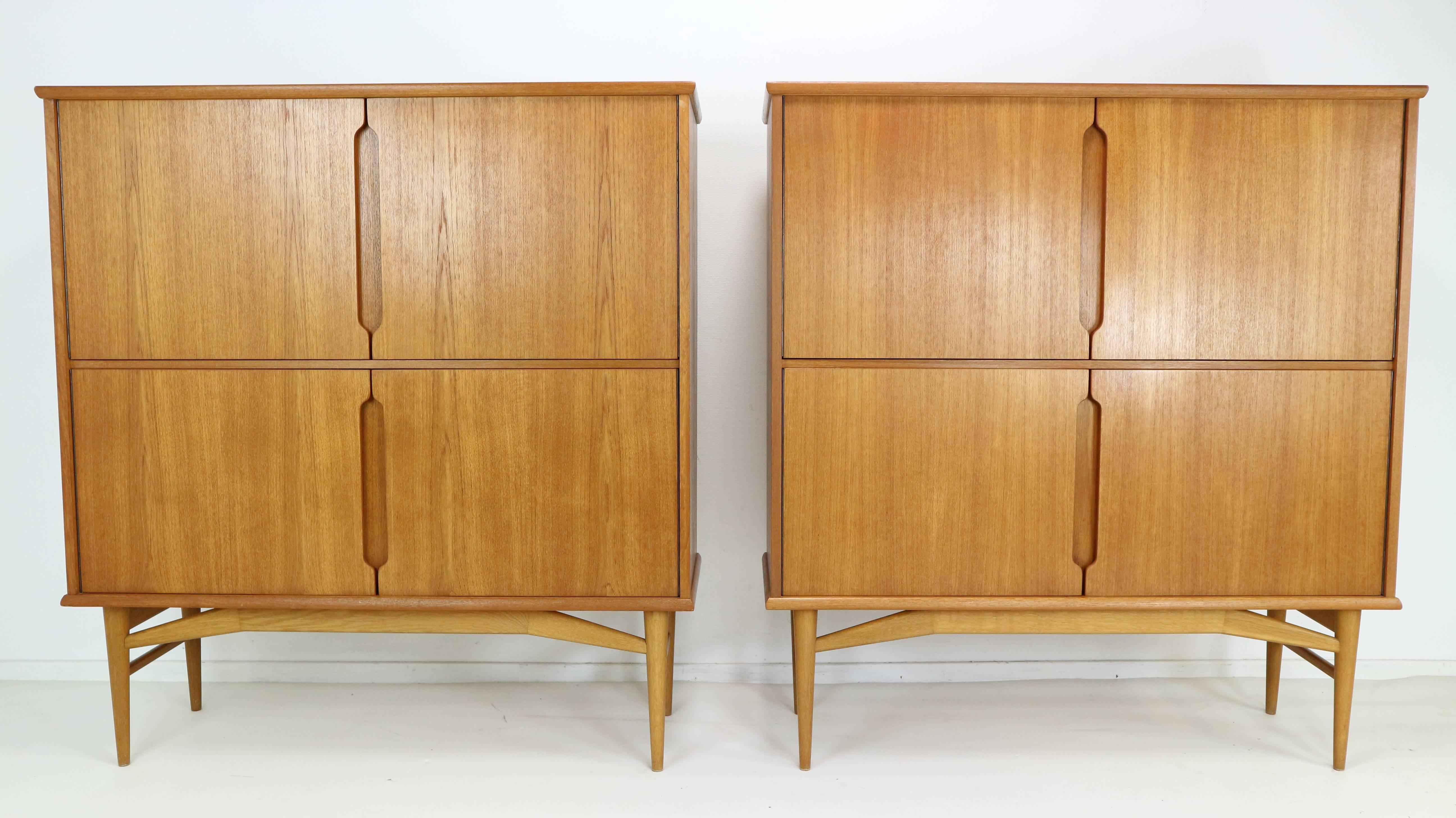 A set of two highboards, 1960s, model Fredericia, produced in 1969. Square structure with surfaces in teak wood veneer, detachable subframe of solid wood. Fitted with four doors and two shelfs. Marked on reverse side.
Also finer on the inside and