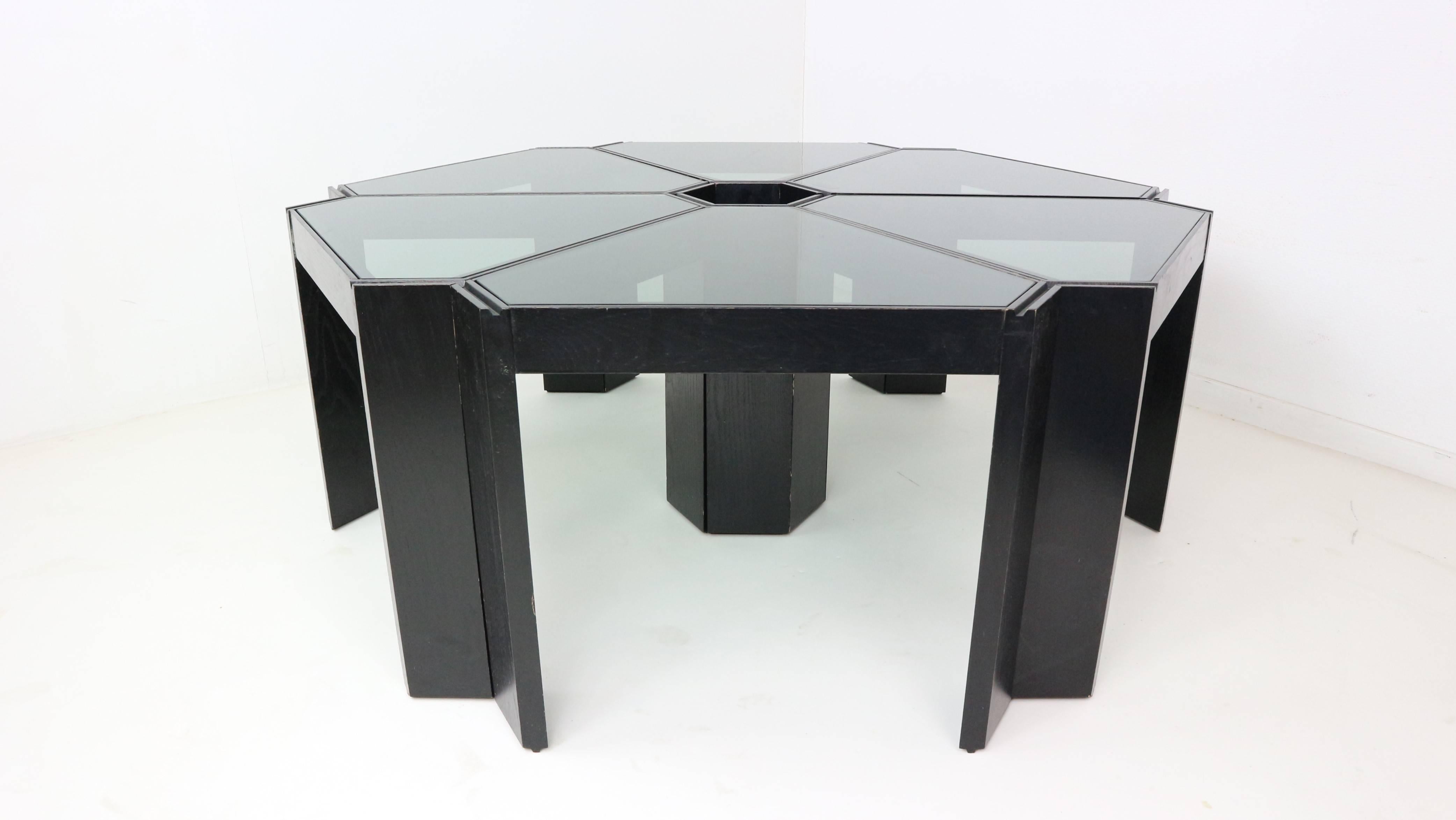 These six stacking tables were made by Porada Arredi in Italy, they can be arranged in many different ways.
The frames are made of black lacquered Wenge wood and the tops of smoked glass.
 