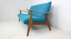 Danish design teak sofa newly upholstered in blue velvet