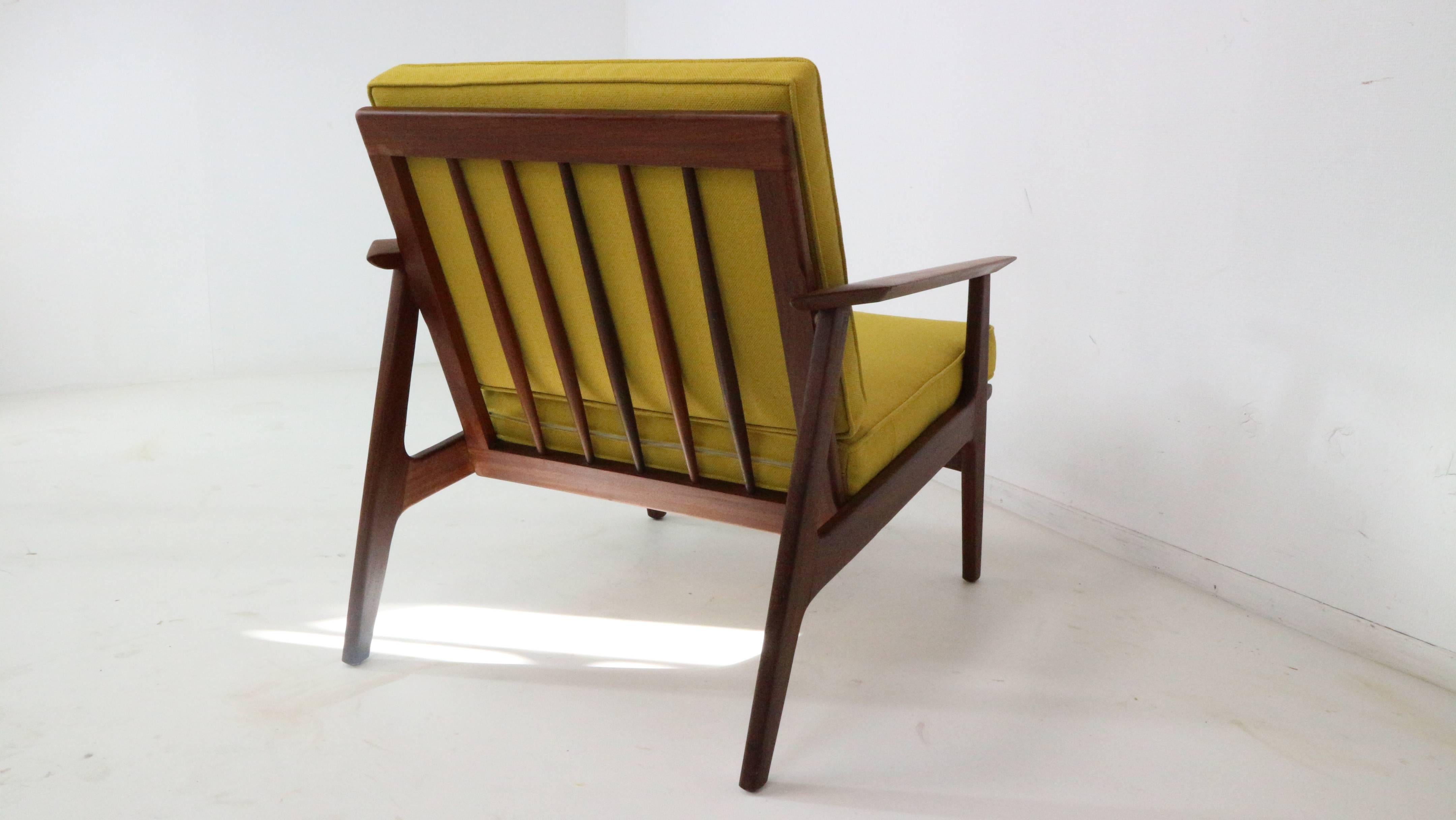Sharp lines and well designed vintage Danish lounge chair.
The mustard yellow fabric gives a perfect contrast with the darker wood, tree chairs available.