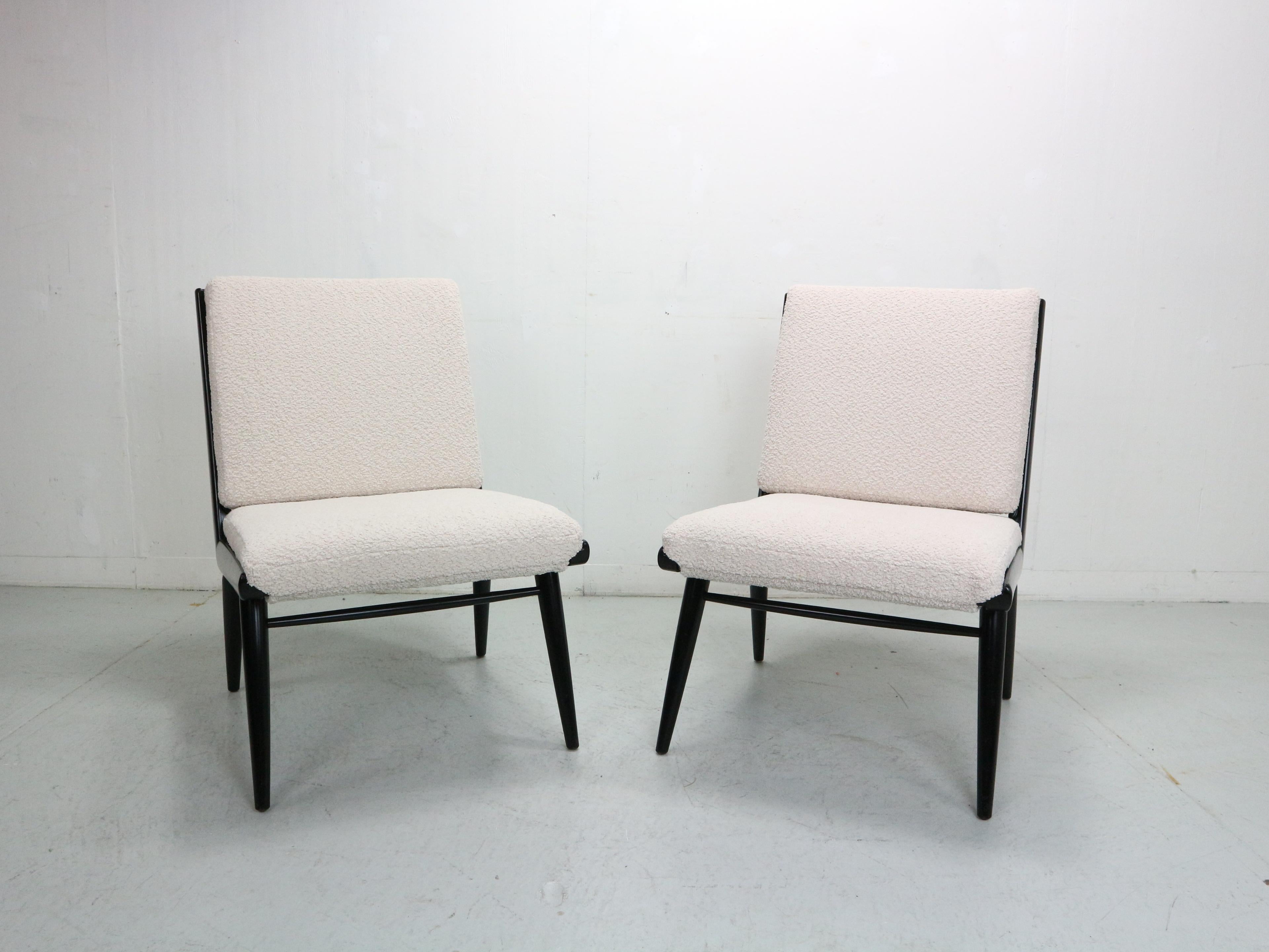 Hans Mitzlaff for Eugen Schmidt Soloform, two armchairs / lounge chairs, 'Boomerang' model, wood, fabric, designed in 1953, Germany. A pair of wooden armchairs with black lacquered frame. Off-white / creme bouclé  felt pads fastened with snaps,