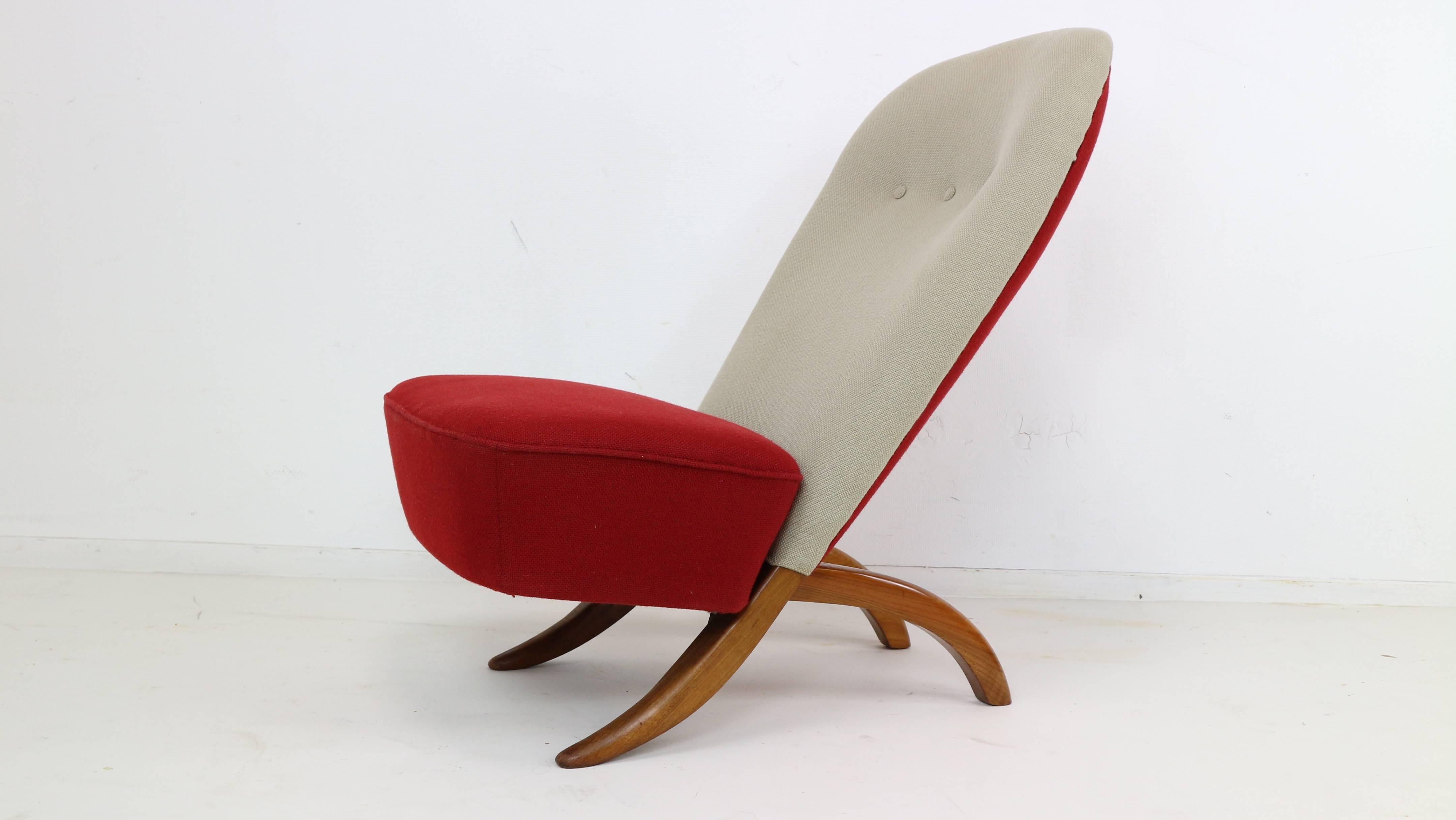 A pair of iconic easy chairs, model Congo, by Dutch designer Theo Ruth for the firm Artifort 1952.
The chair draws it's inspiration from a traditional African chair, each chair consist of 2 pieces that slot into one another and held together by the
