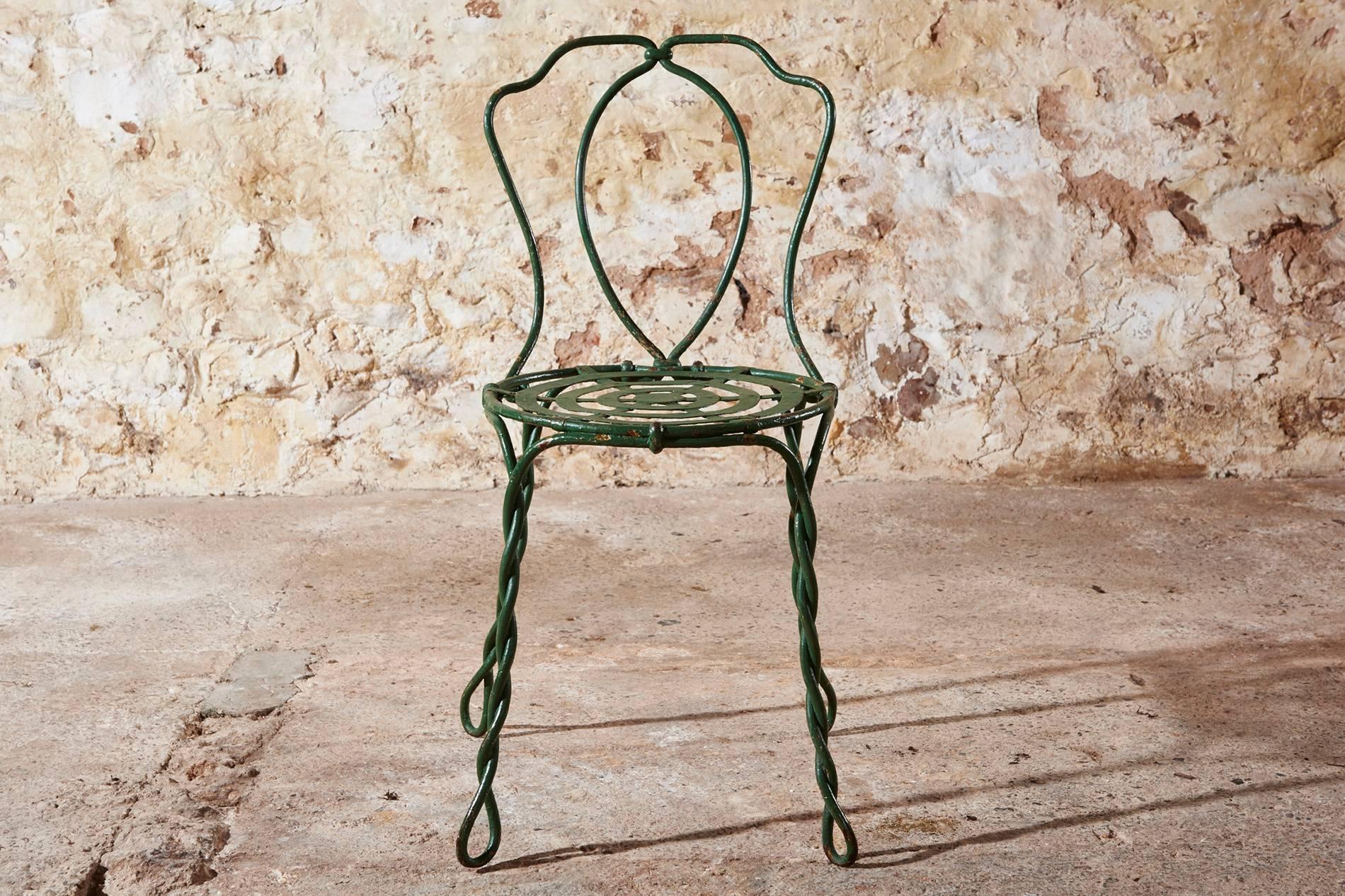 These fantastic and rare Vachon cafe chairs were made in mid-19th century in Paris. What makes them even rarer is that we have a set of six.

They have a rope style twisted wrought iron frame and a beautiful and original green patina.

These chairs