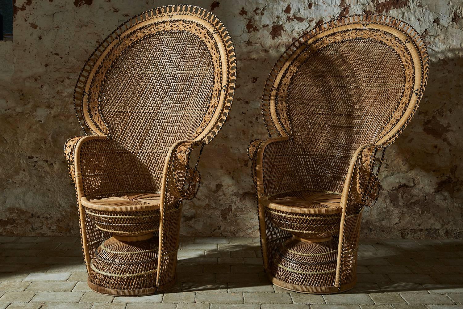 Outstanding matching pair of Italian Peacock chairs made famous by the 1970s film Emanuelle in excellent vintage condition.