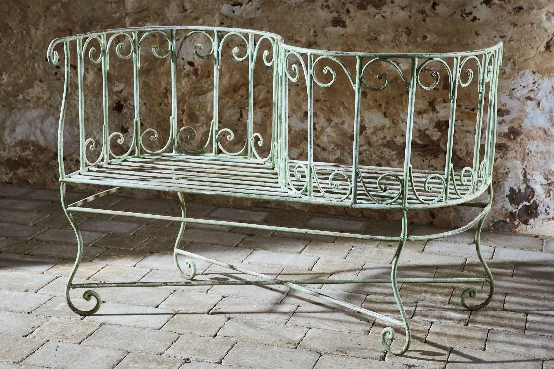 This beautiful wrought iron tête à tête/love seat originates from Scotland.

Hand-forged and decorated with a scroll design the pale green patina just oozes style.

It would add a touch of glamour to any garden or terrace and would make a