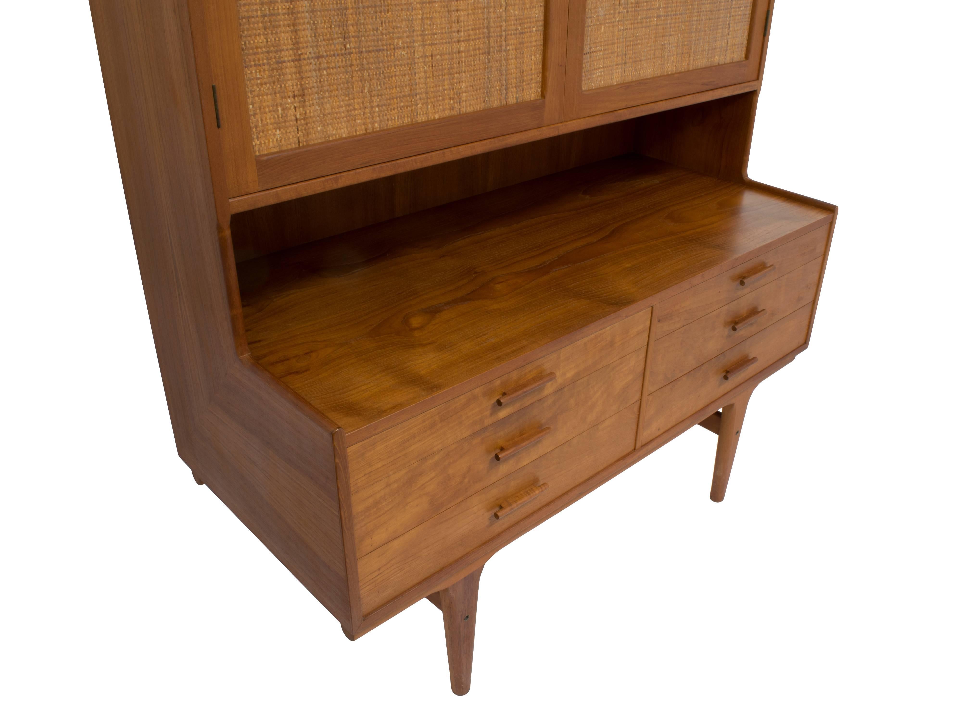 This mid-century Danish cabinet is extraordinary, a tall and gorgeous example of the quality and precision of Danish cabinetmakers in the 1950s, just an exquisite example of authentic Danish craftsmanship. Although it is unmarked by its maker (“Made
