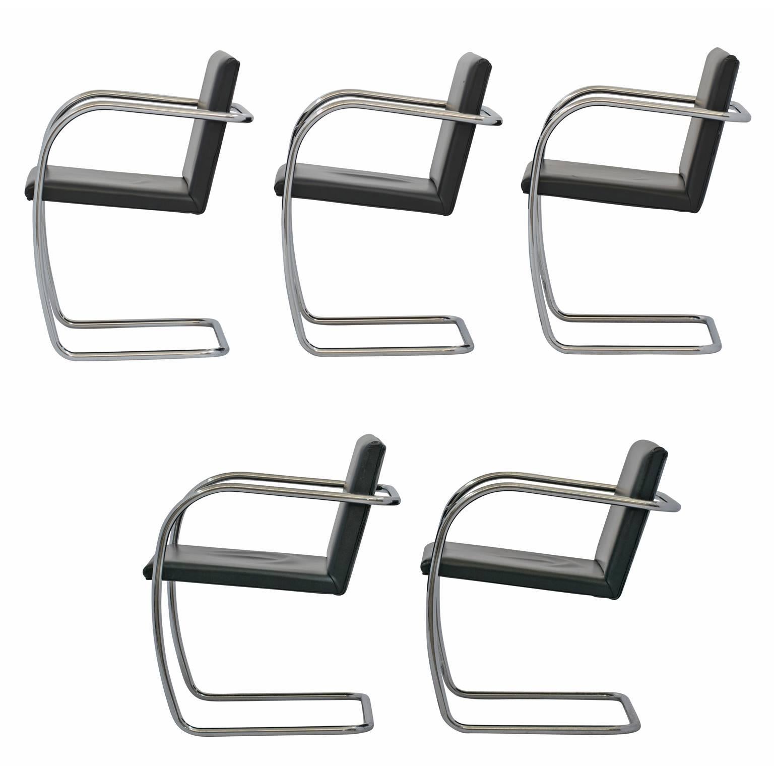 Set of five Brno style chairs, in the manner of Mies van der Rohe’s iconic, cantilevered chairs in leather and tubular steel. This set of Brno style cantilevered chairs features frames formed from a single piece of bent tubular steel with chrome
