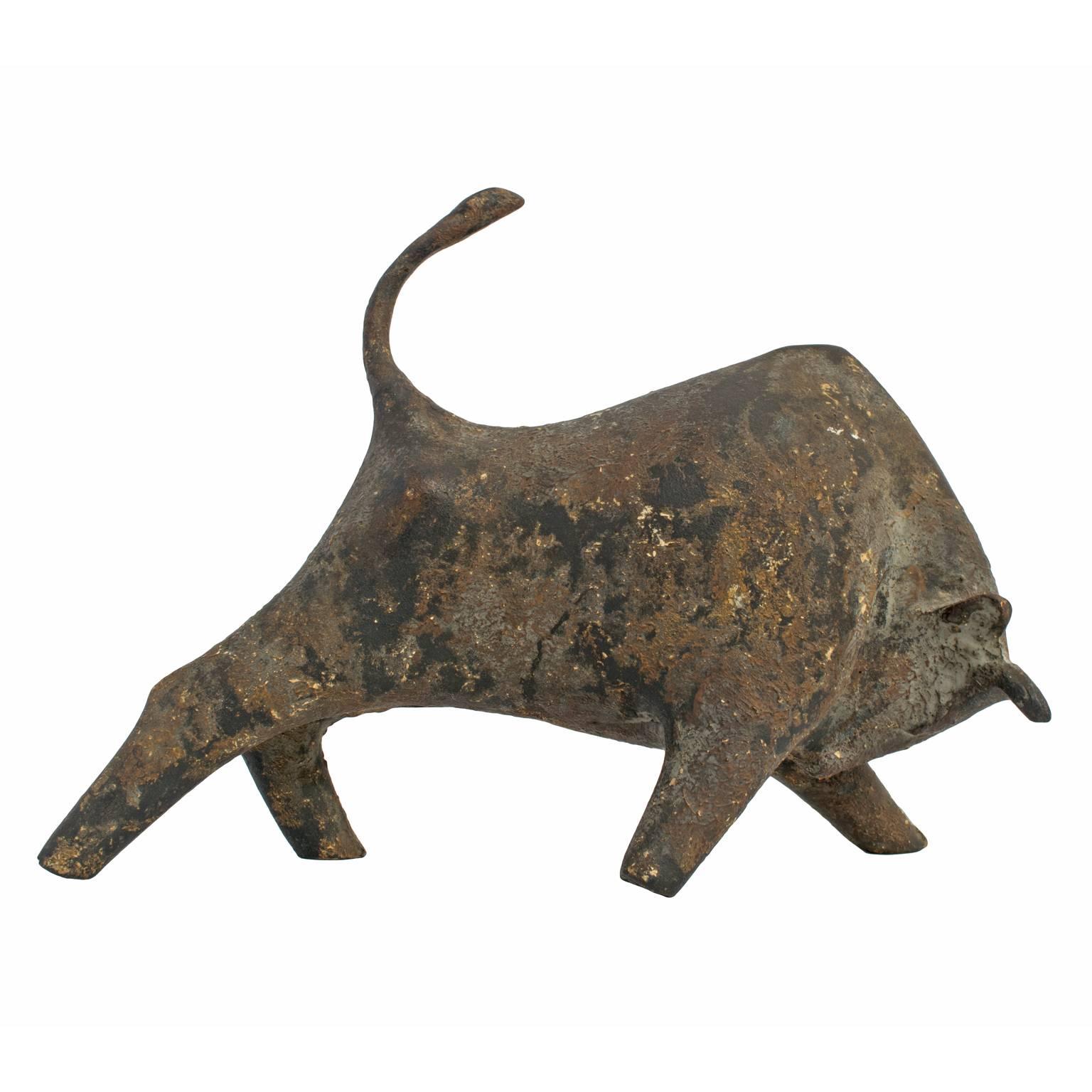Mid-Century Brutalist bull figure in cast iron, with a beautiful rustic patina. Modernist and Picasso-esque, this Mid-Century Brutalist bull sculpture was purchased in Japan by its original owner and is thought to be designed by Miyazawa Kanae.