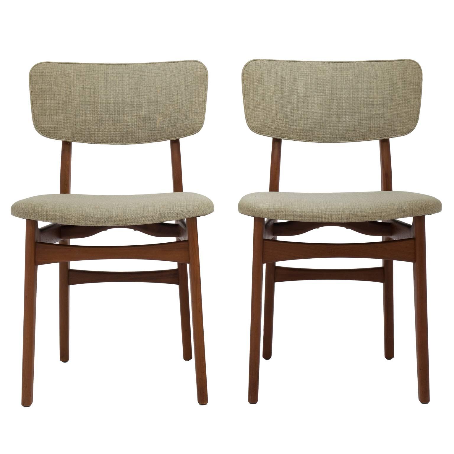 Mid-Century Danish modern side, desk or dining chair attributed to master cabinetmaker Gustav Bertelsen. Each chair is solid teak in its original pale green fabric, cushioned with horsehair. Two chairs available, sold separately. 